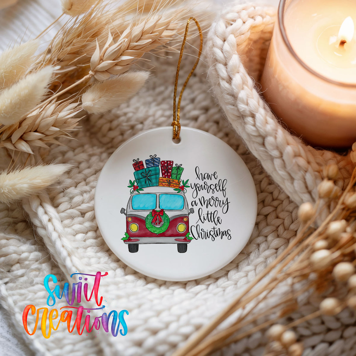 Have Yourself a Merry Little Christmas vintage truck ceramic Christmas ornament styled beside a candle and cozy knit blanket
