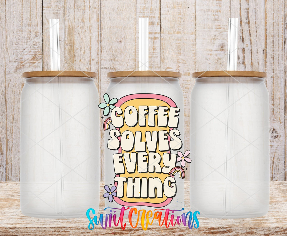 Coffee Solves Everything UV DTF transfer applied to a clear glass can set from Swiit Creations