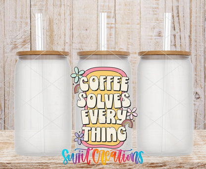 Coffee Solves Everything UV DTF transfer applied to a clear glass can set from Swiit Creations