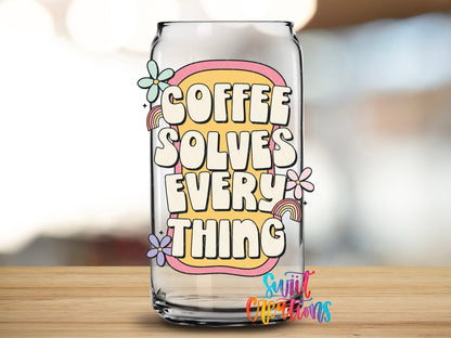 Coffee Solves Everything UV DTF transfer applied to a clear glass can from Swiit Creations