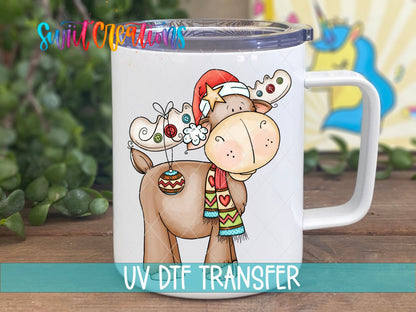 Swiit Creations Cute Christmas Moose UV DTF transfer displayed on a white coffee mug