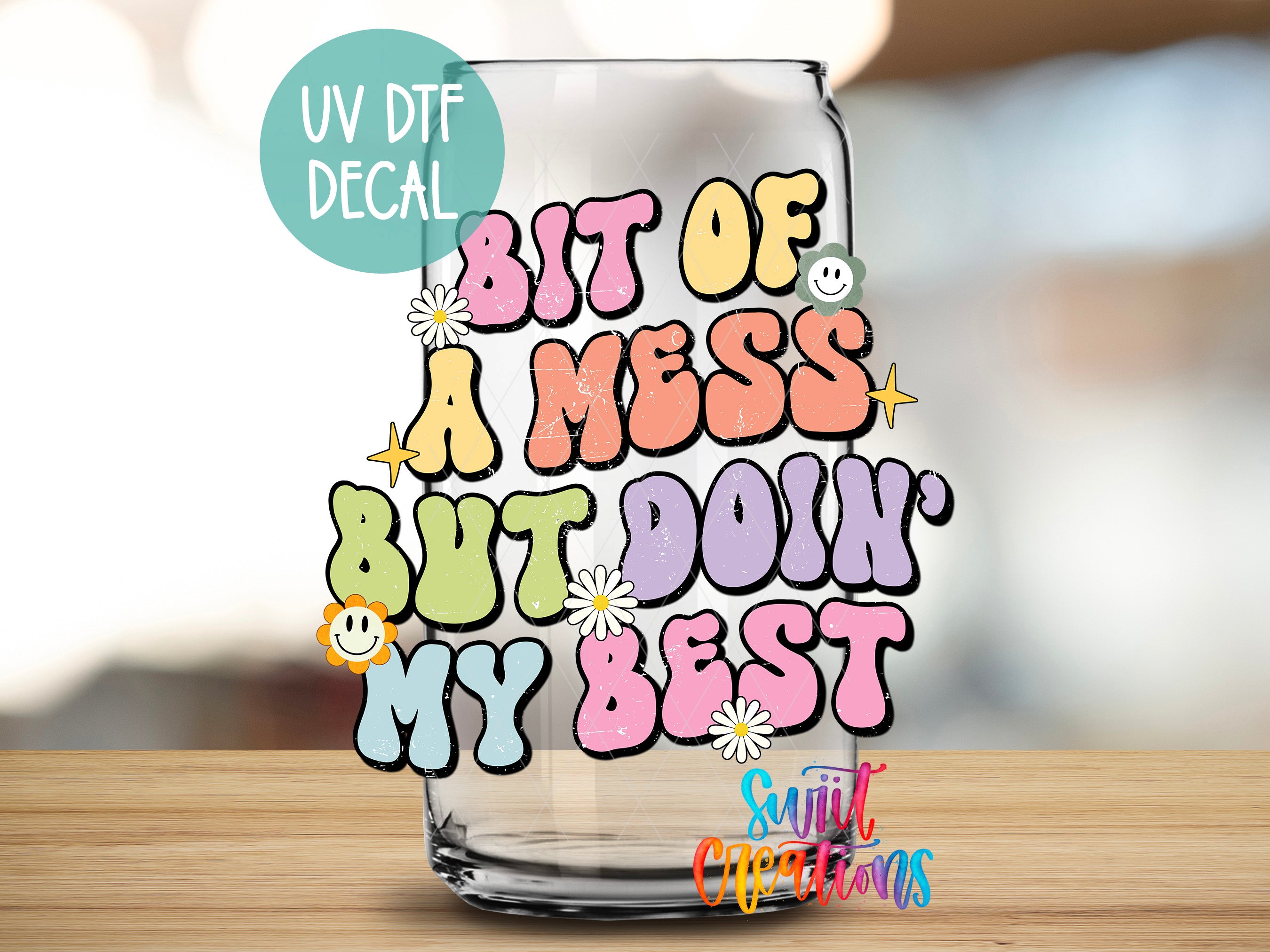 a glass with a message on it sitting on a table