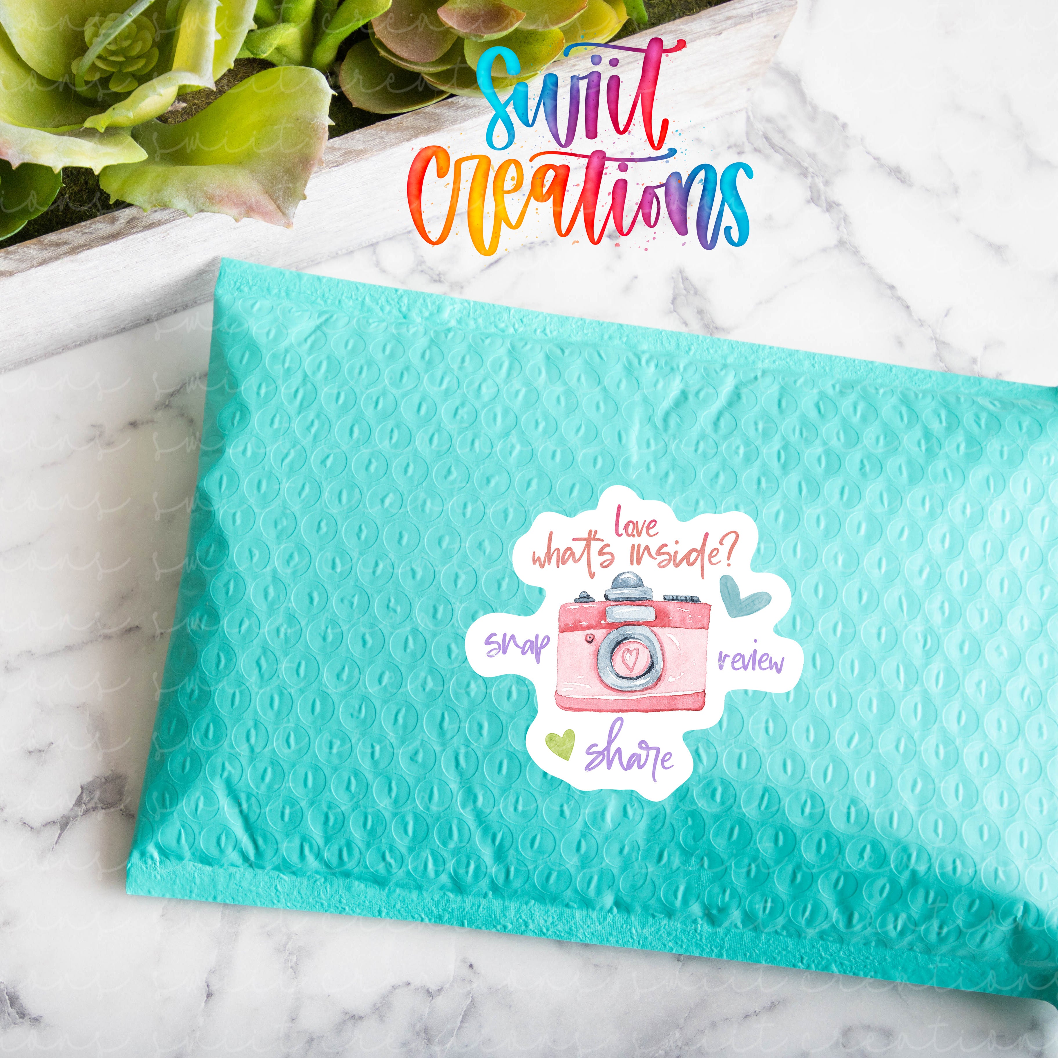 a blue envelope with a picture of a camera on it