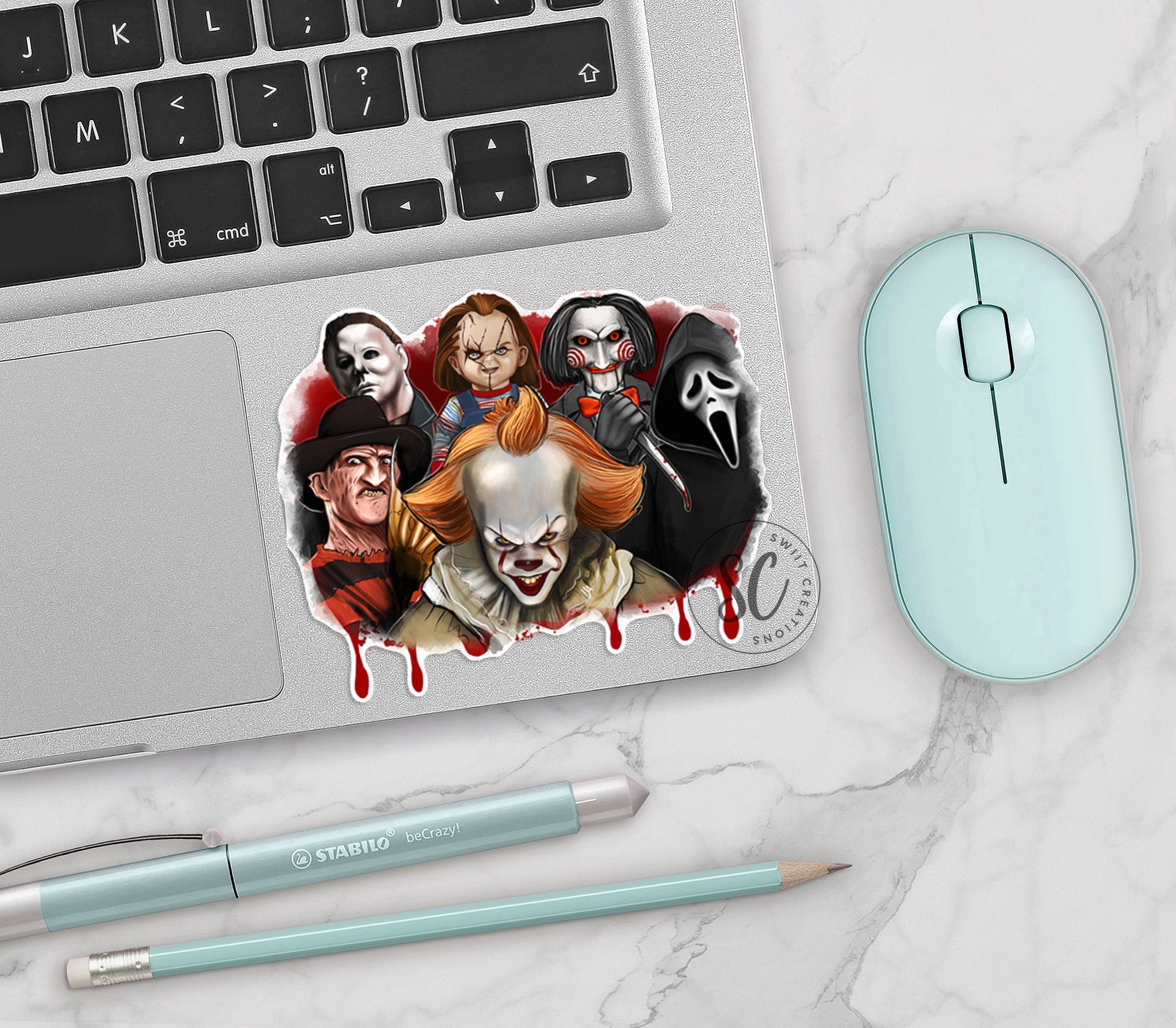 a laptop with a sticker of a group of people on it