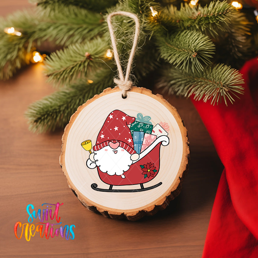 A wooden ornament featuring a gnome riding a sleigh, carrying gifts, is hanging on a Christmas tree.