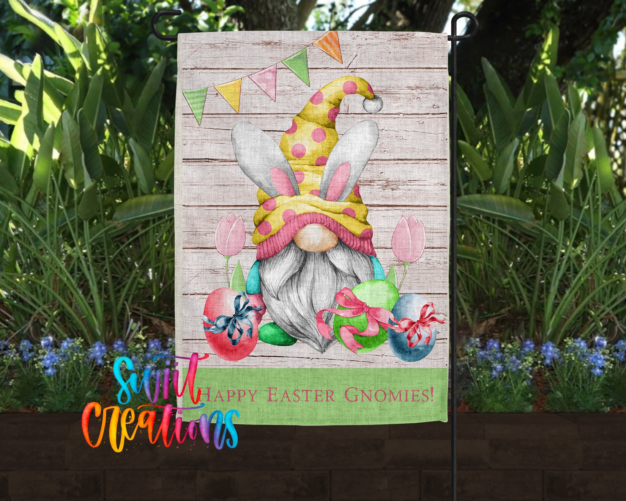 A colorful Easter-themed garden flag featuring a cartoon gnome wearing a yellow hat with pink polka dots, surrounded by Easter eggs, flowers, and a banner that says "Happy Easter Gnomes!"