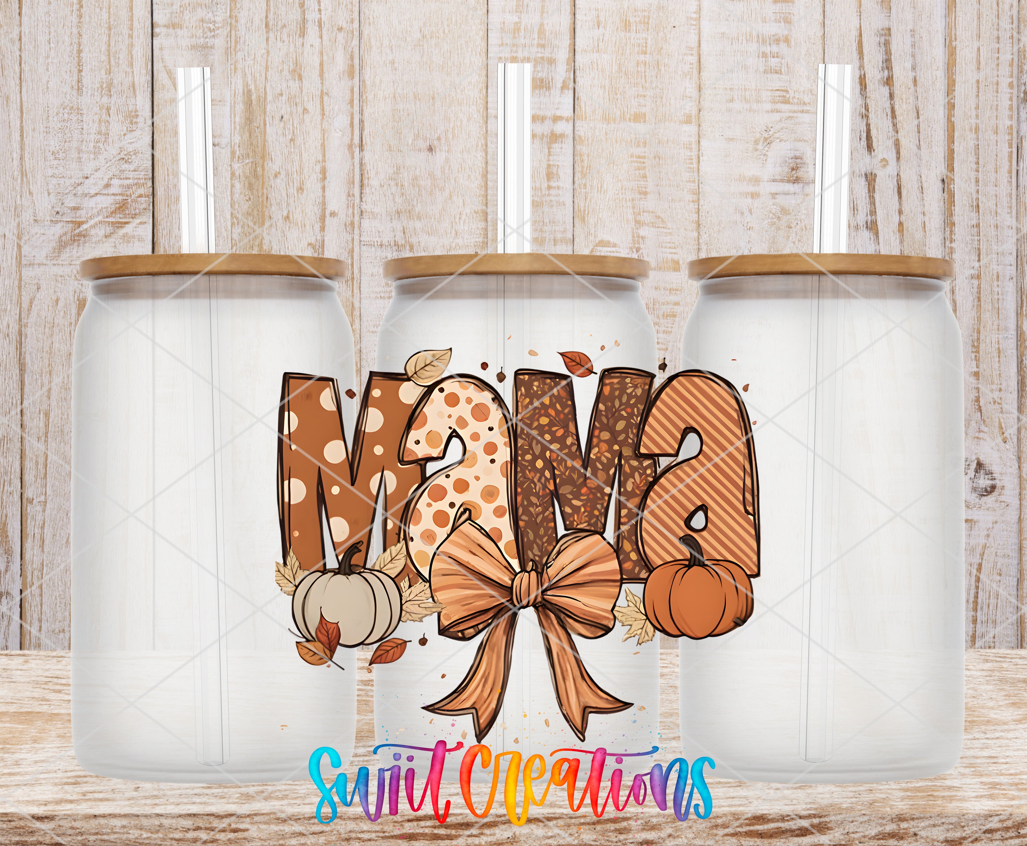 three glass jars with the word "MANA" written on them, along with autumn-themed decorations such as pumpkins and leaves.