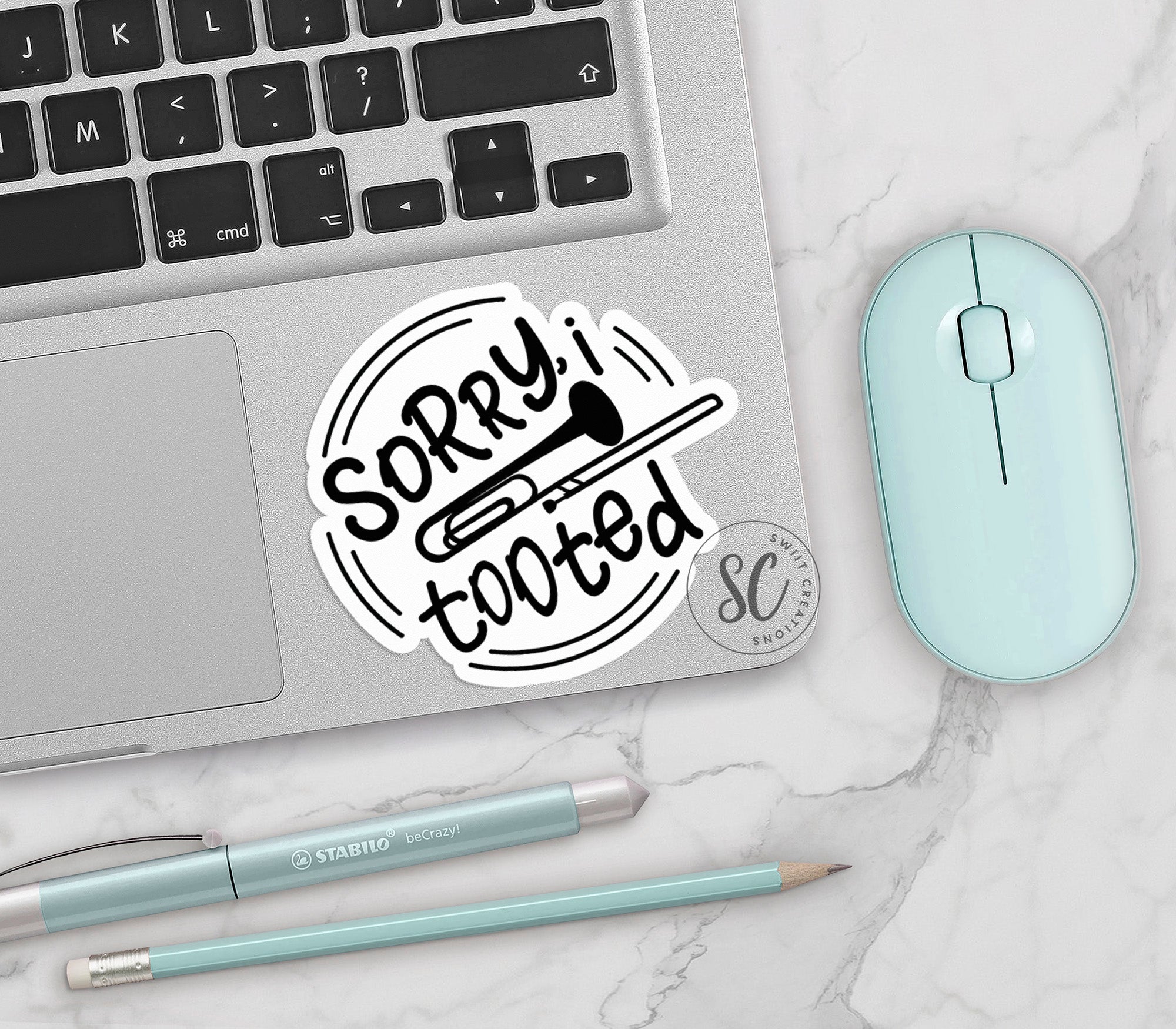 a laptop computer sitting on top of a white table