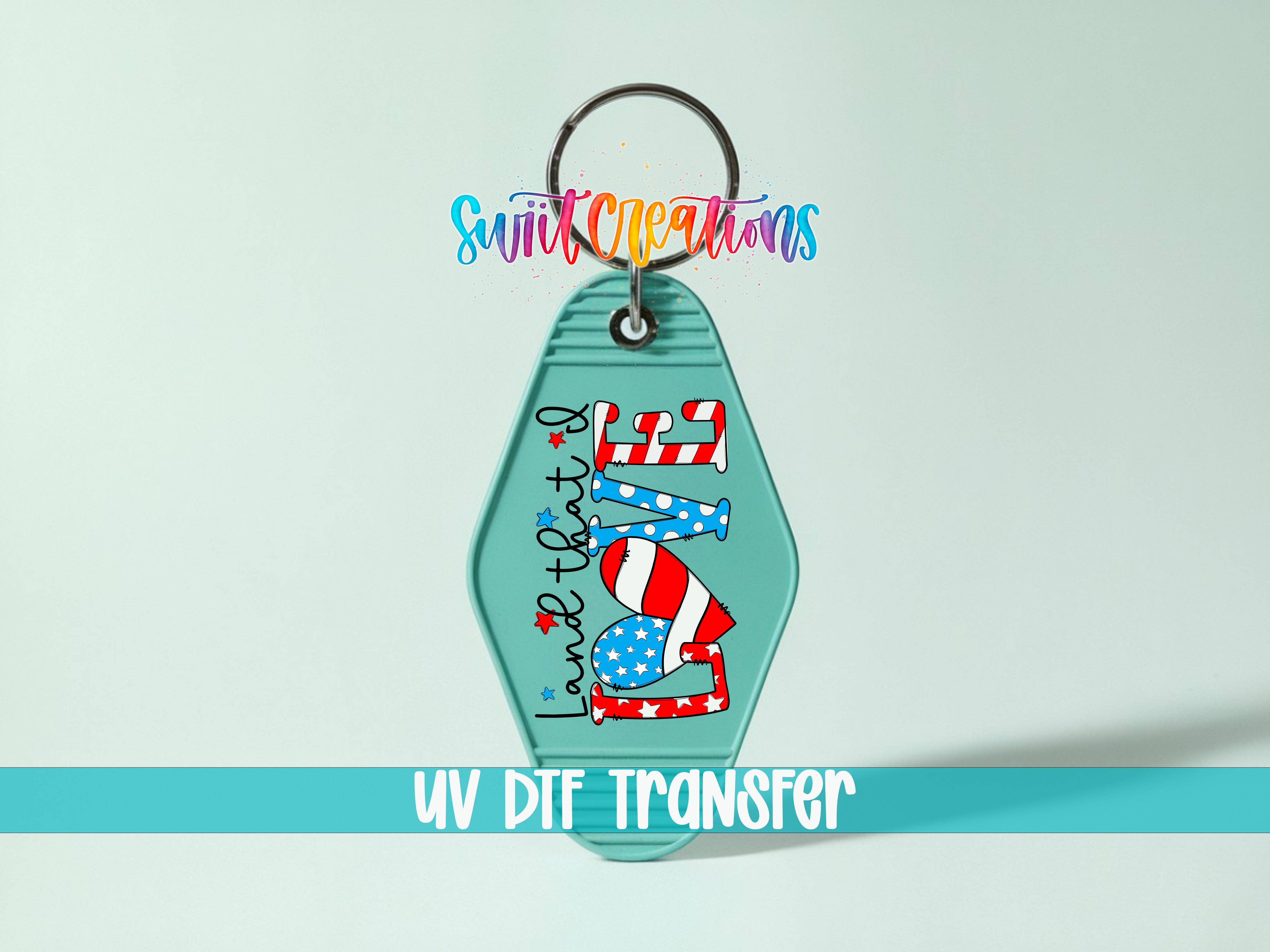 A keychain with a patriotic design featuring an American flag and the text "Land that love" printed on it.