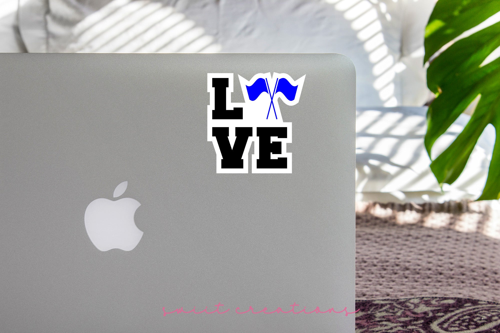 a laptop computer sitting on top of a table