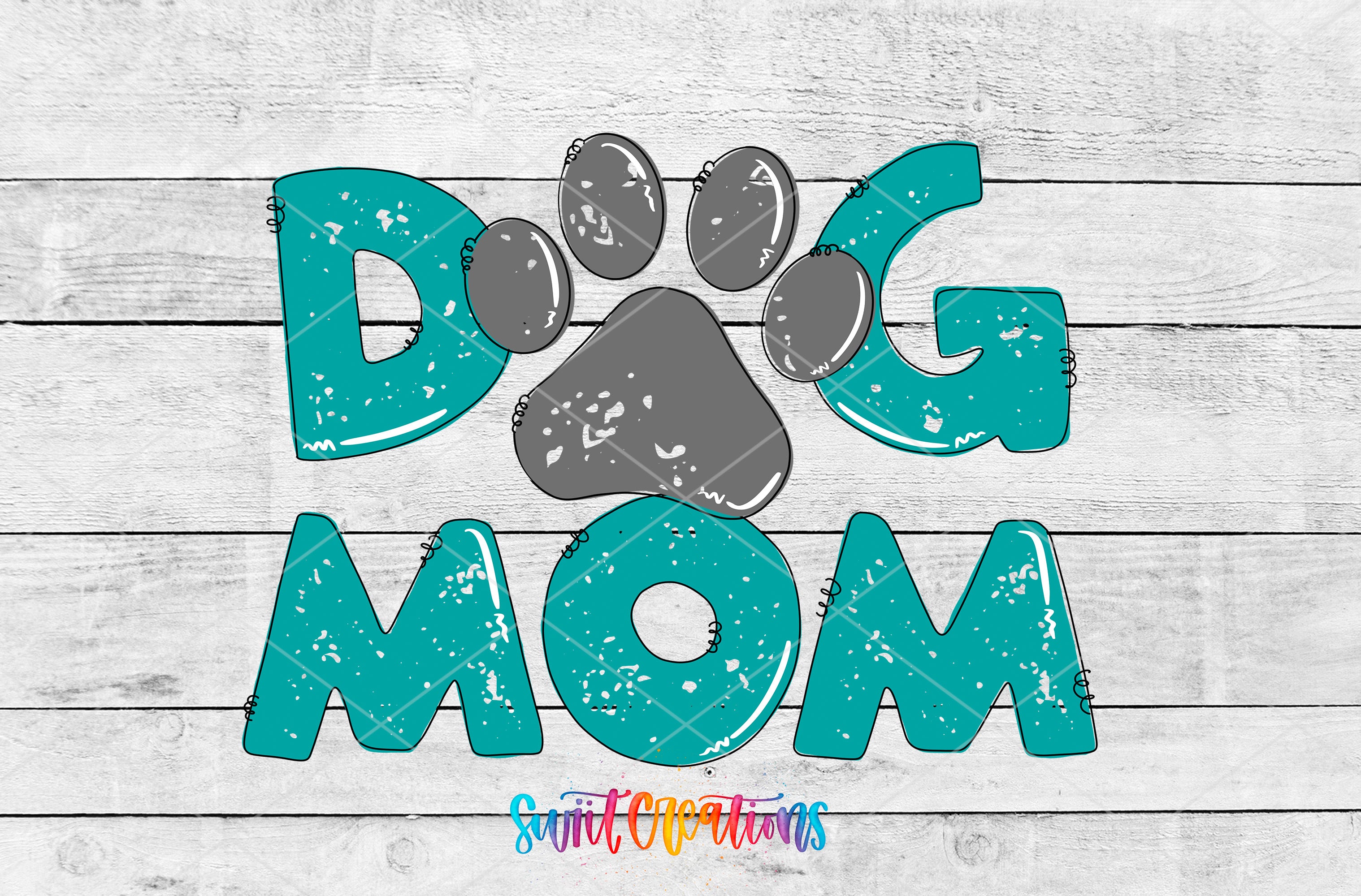 A graphic design featuring the word "DOG MOM" with a paw print and teal-colored letters, all set against a white wooden background.