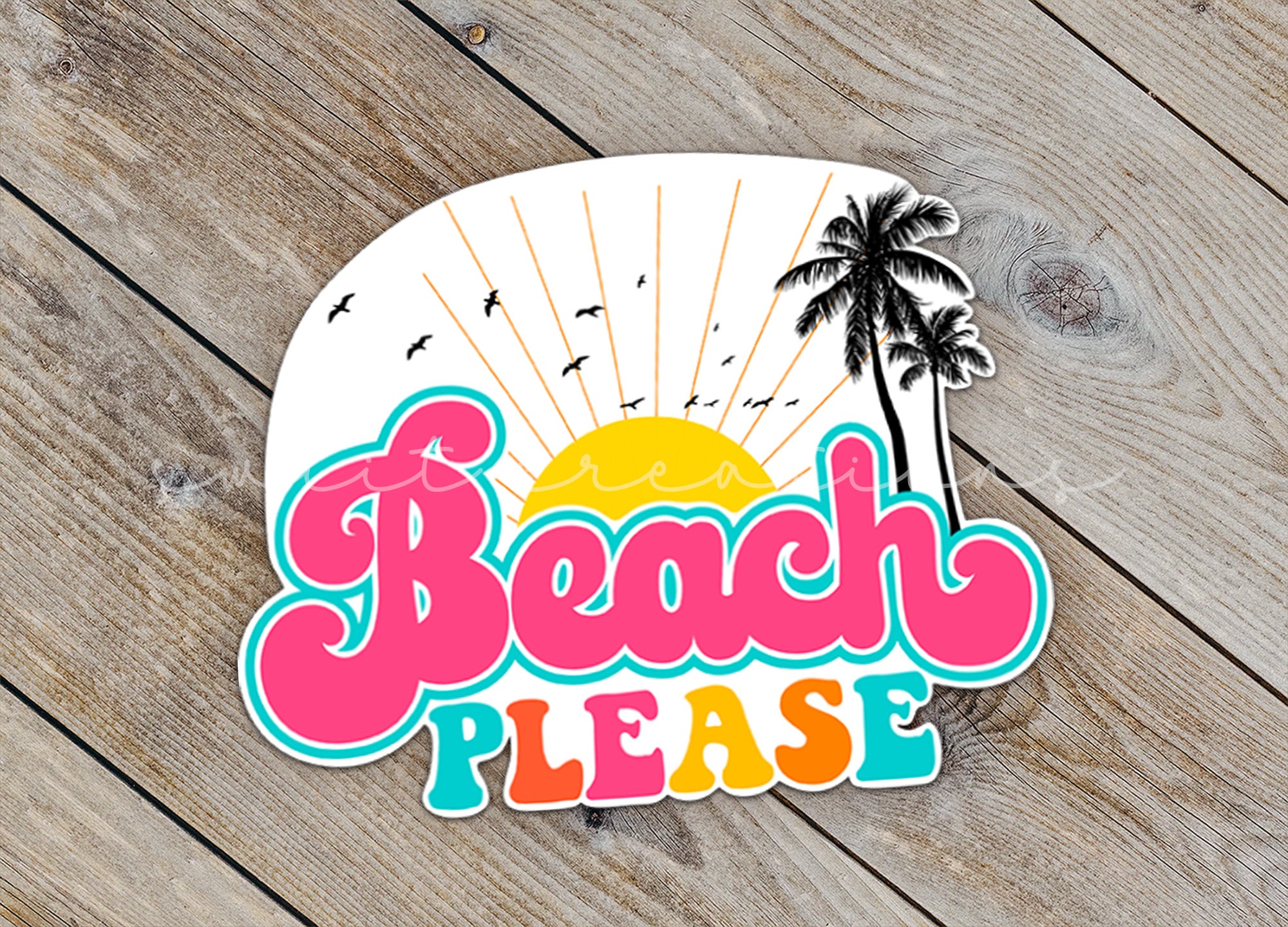 a sticker that says beach please on a wooden surface