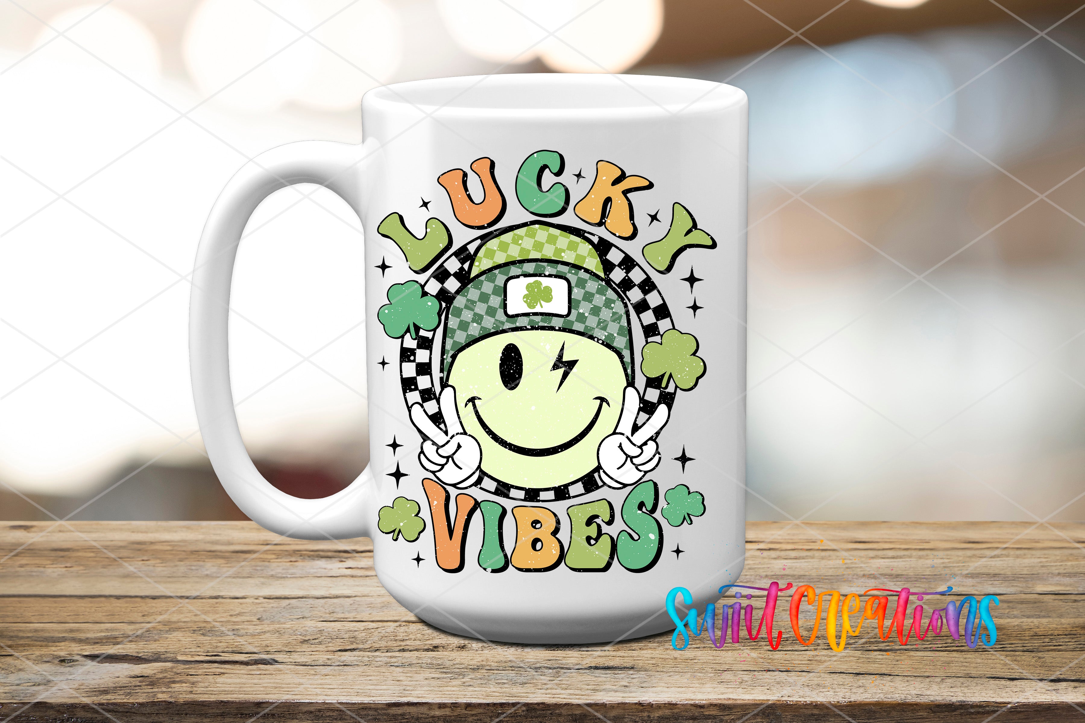 A white ceramic mug with a colorful design featuring a smiling face, a clover, and the text "Lucky Vibes"