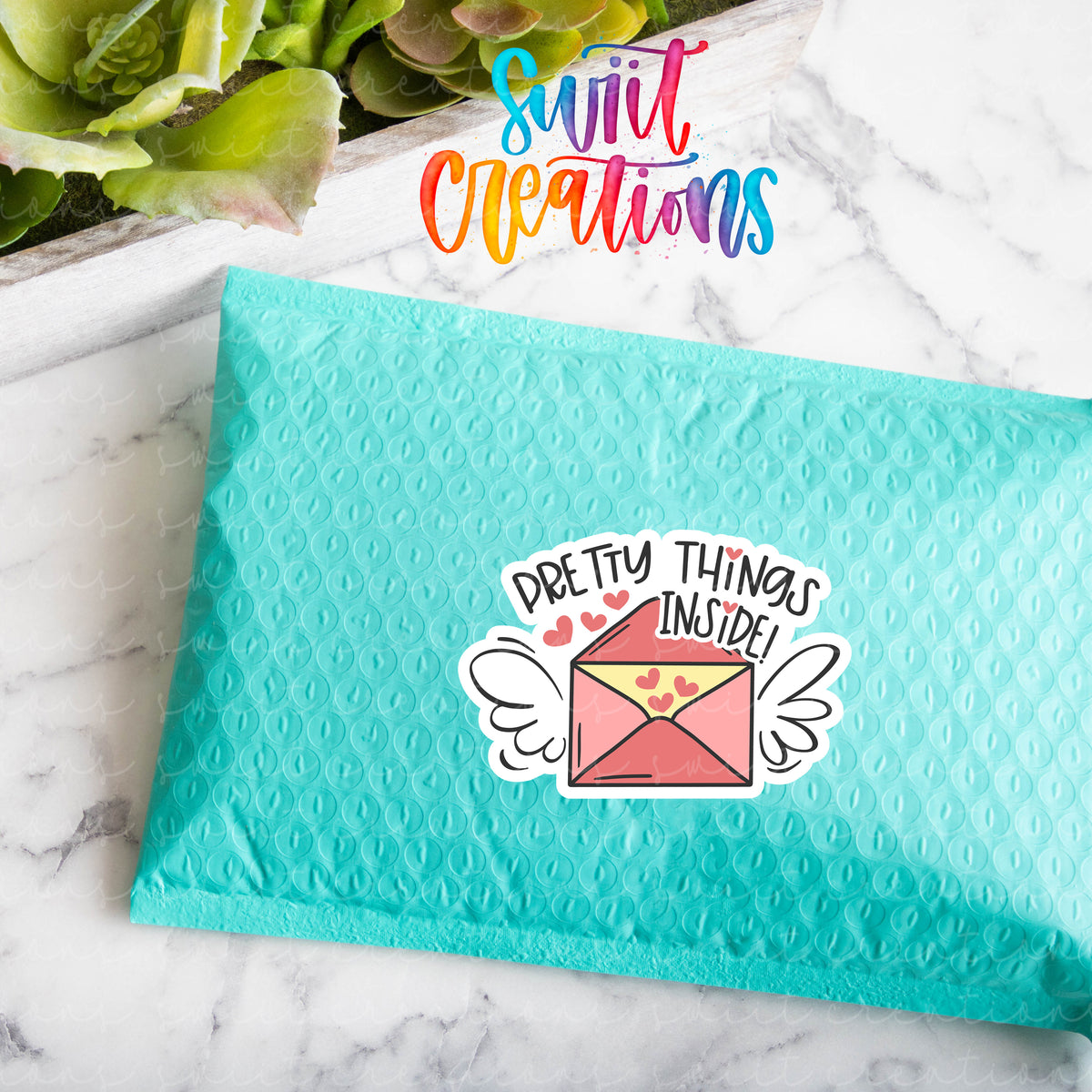 a blue envelope with an envelope sticker on it