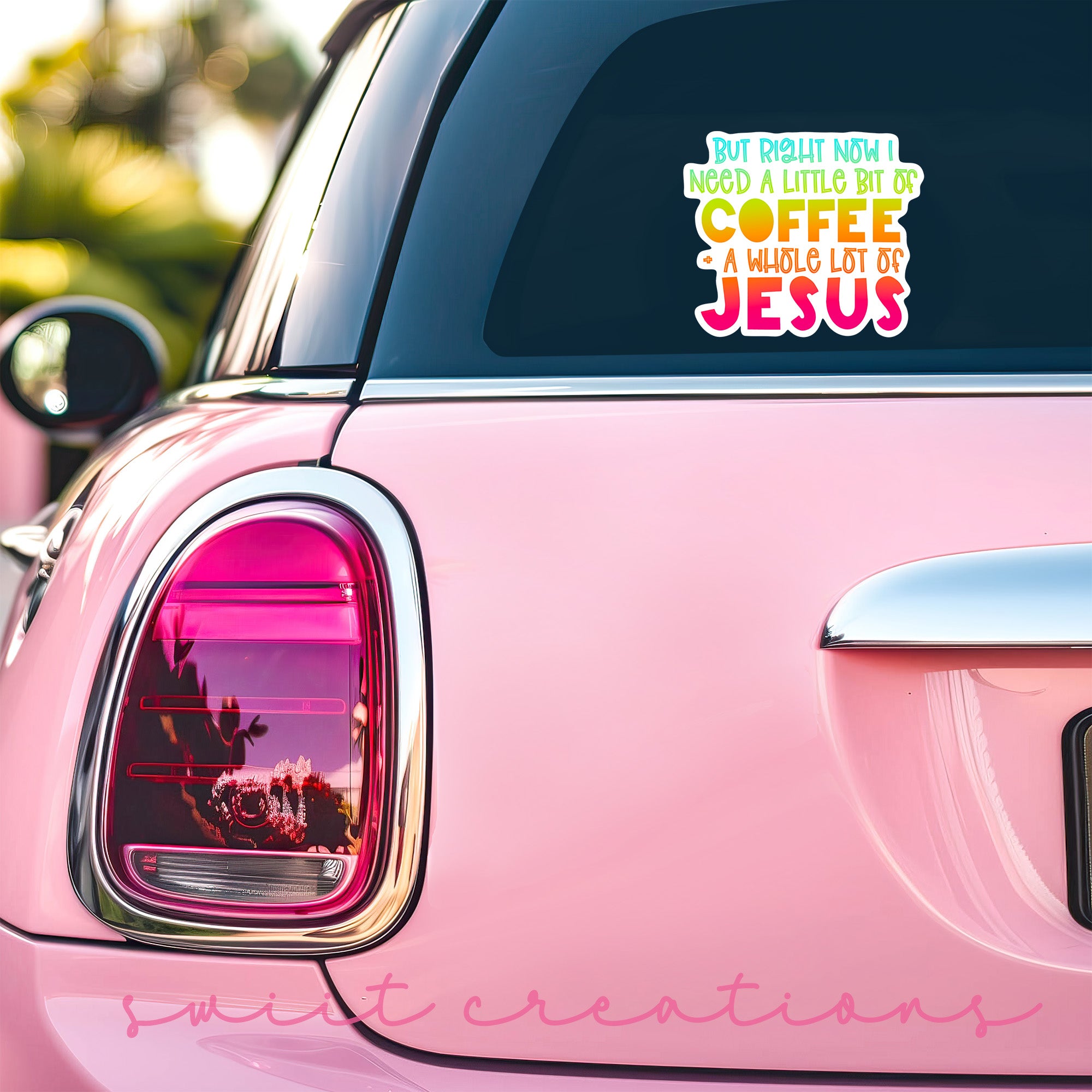 a pink car that has a sticker on it