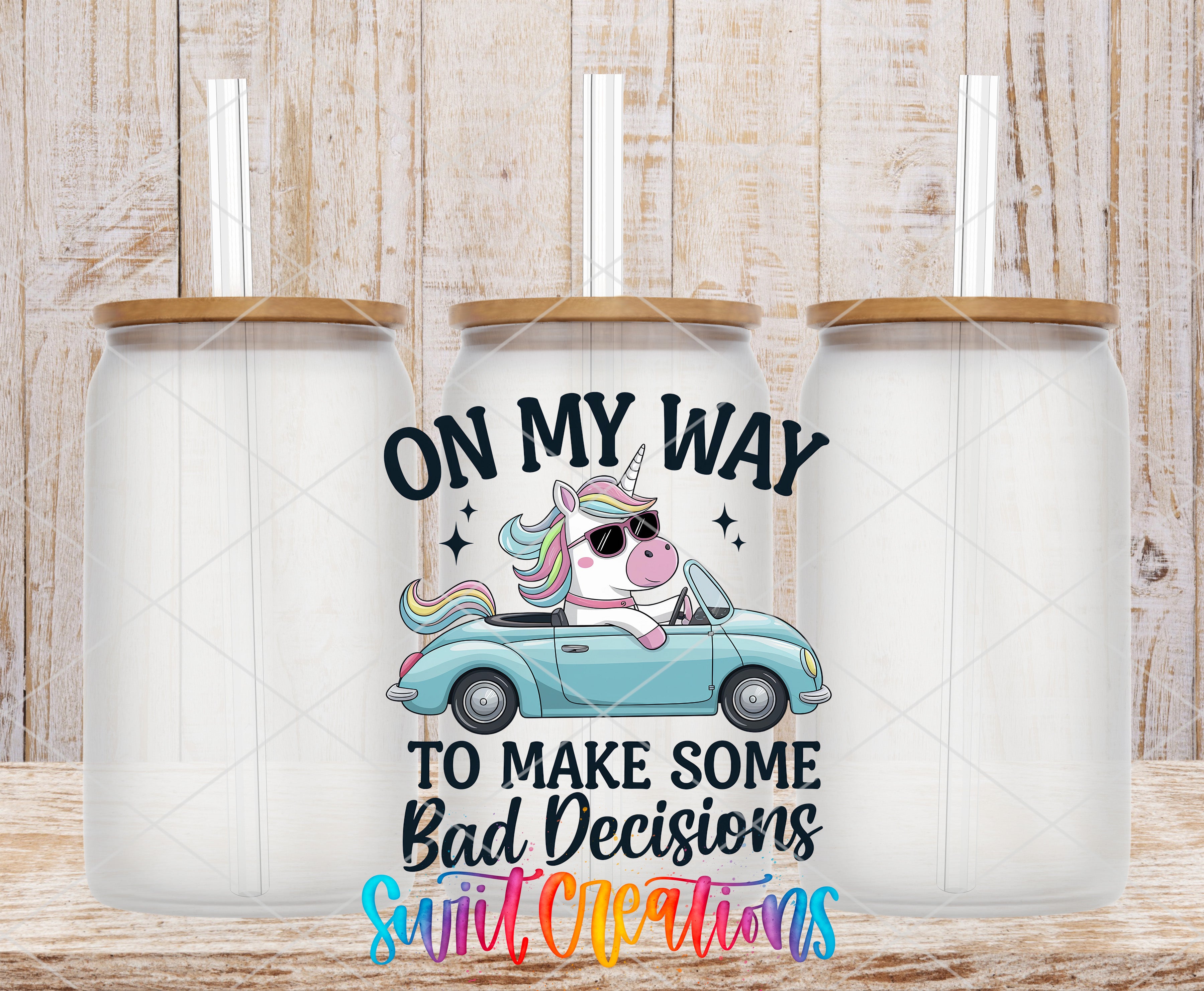 three clear glass jars with straws, each containing a cartoon unicorn. The unicorn is depicted driving a blue car, and the text "ON MY WAY TO MAKE SOME BAD DECISIONS" is written above the unicorn.