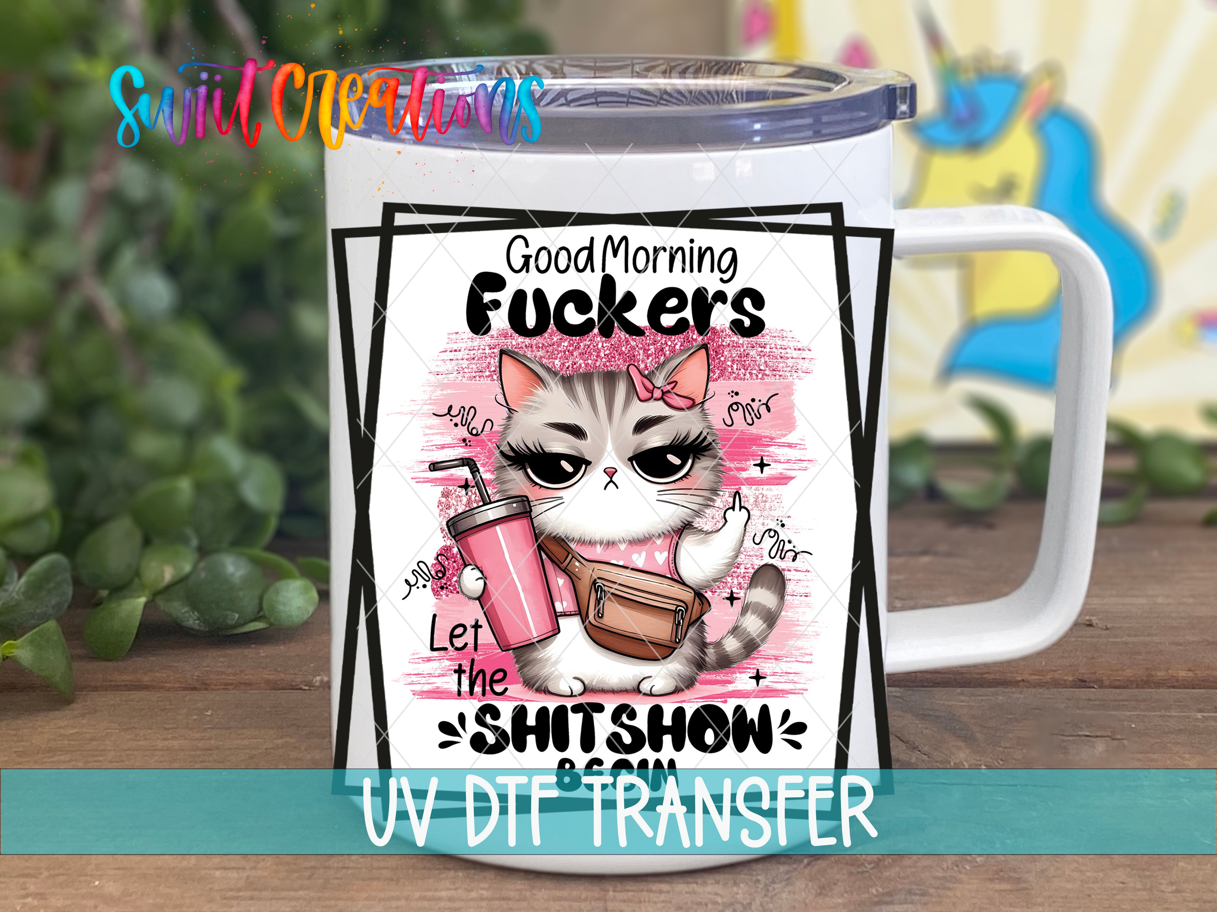 A white mug with a cartoon cat design and text printed on it.
