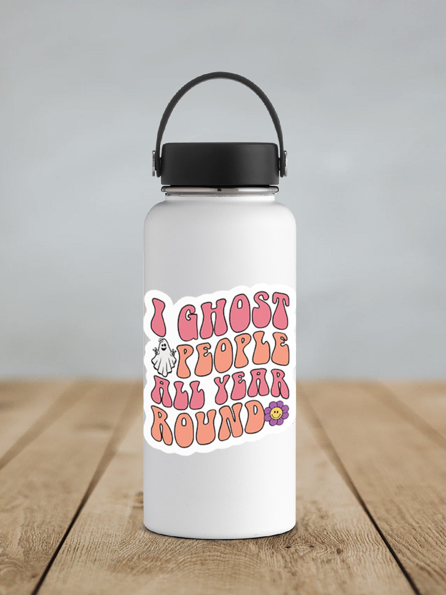 a white water bottle sitting on top of a wooden table