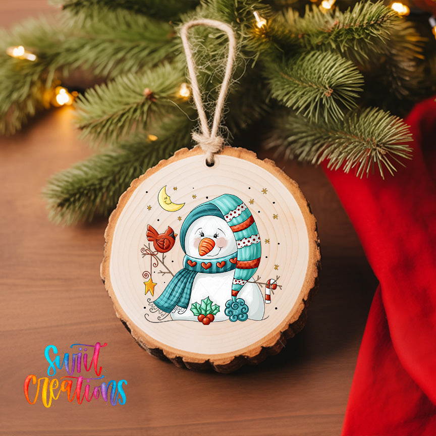 A wooden ornament featuring a snowman with a scarf and hat, surrounded by various winter-themed elements such as a bird, a snowflake, and a star.