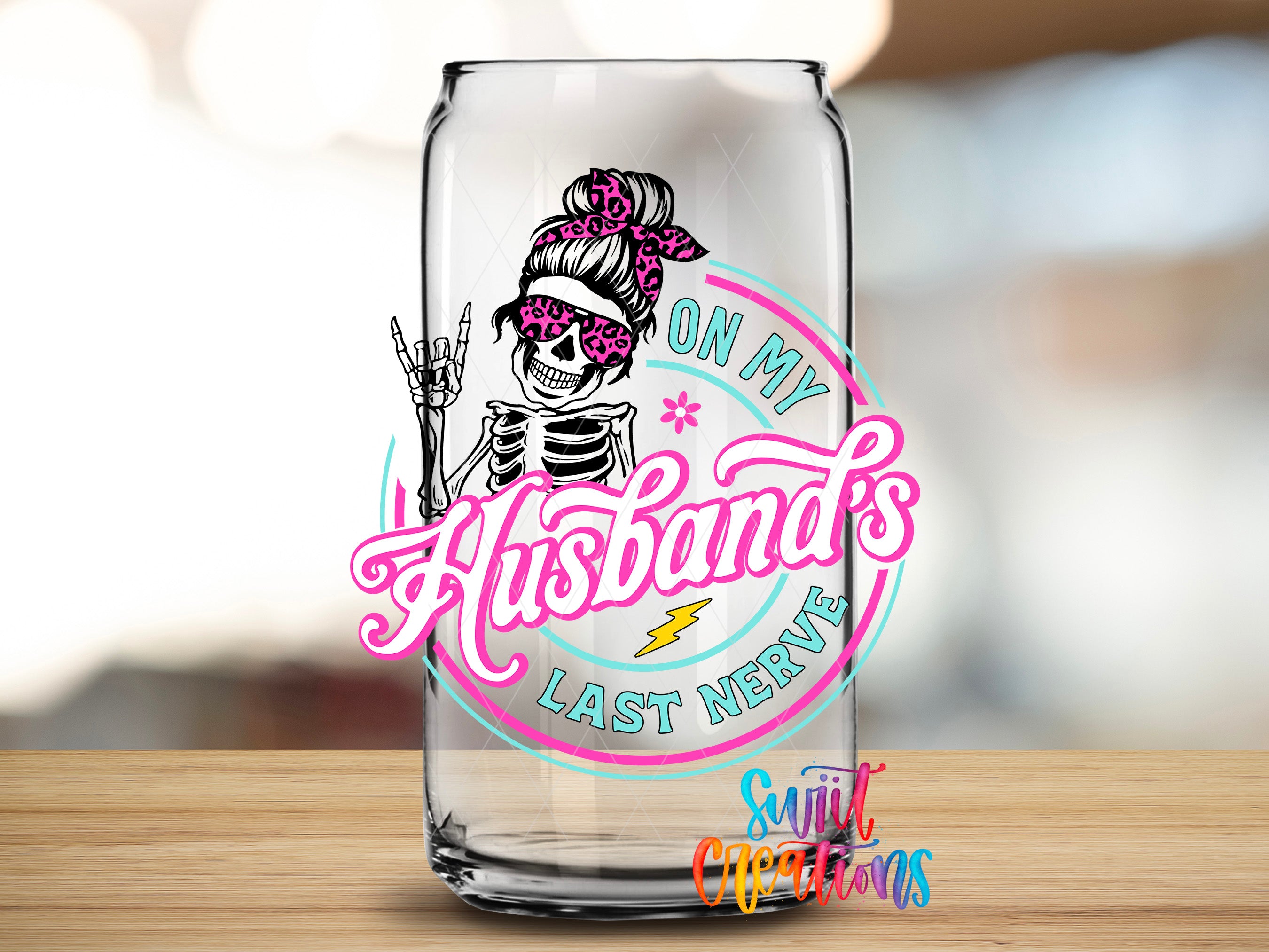 A glass can with a graphic design featuring a skeleton wearing sunglasses and the text "On My Husband's Last Nerve" in a stylized font.