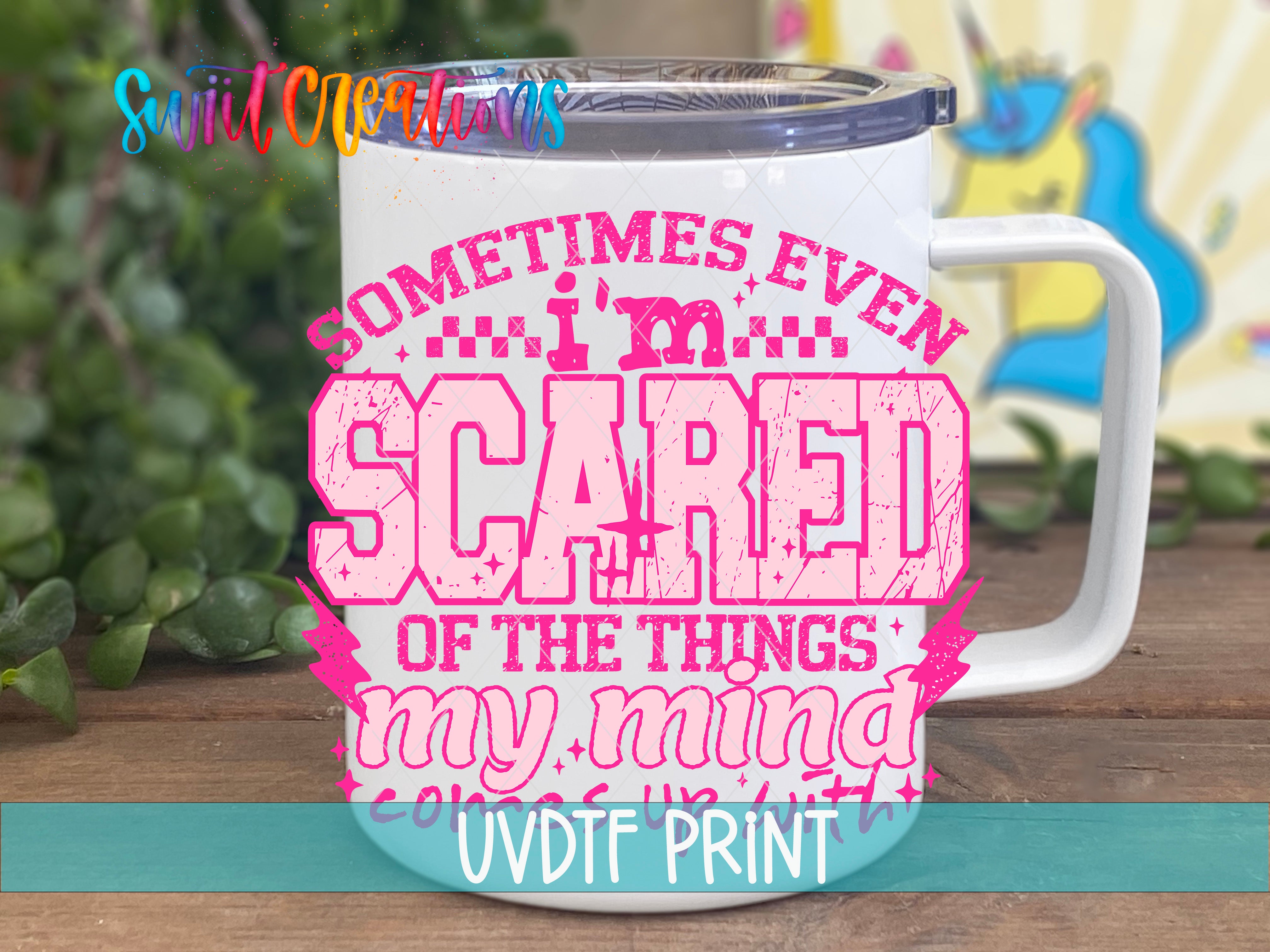 A white mug with a printed design on it, featuring a humorous text that reads "Sometimes even I'm scared of the things my mind does with me".