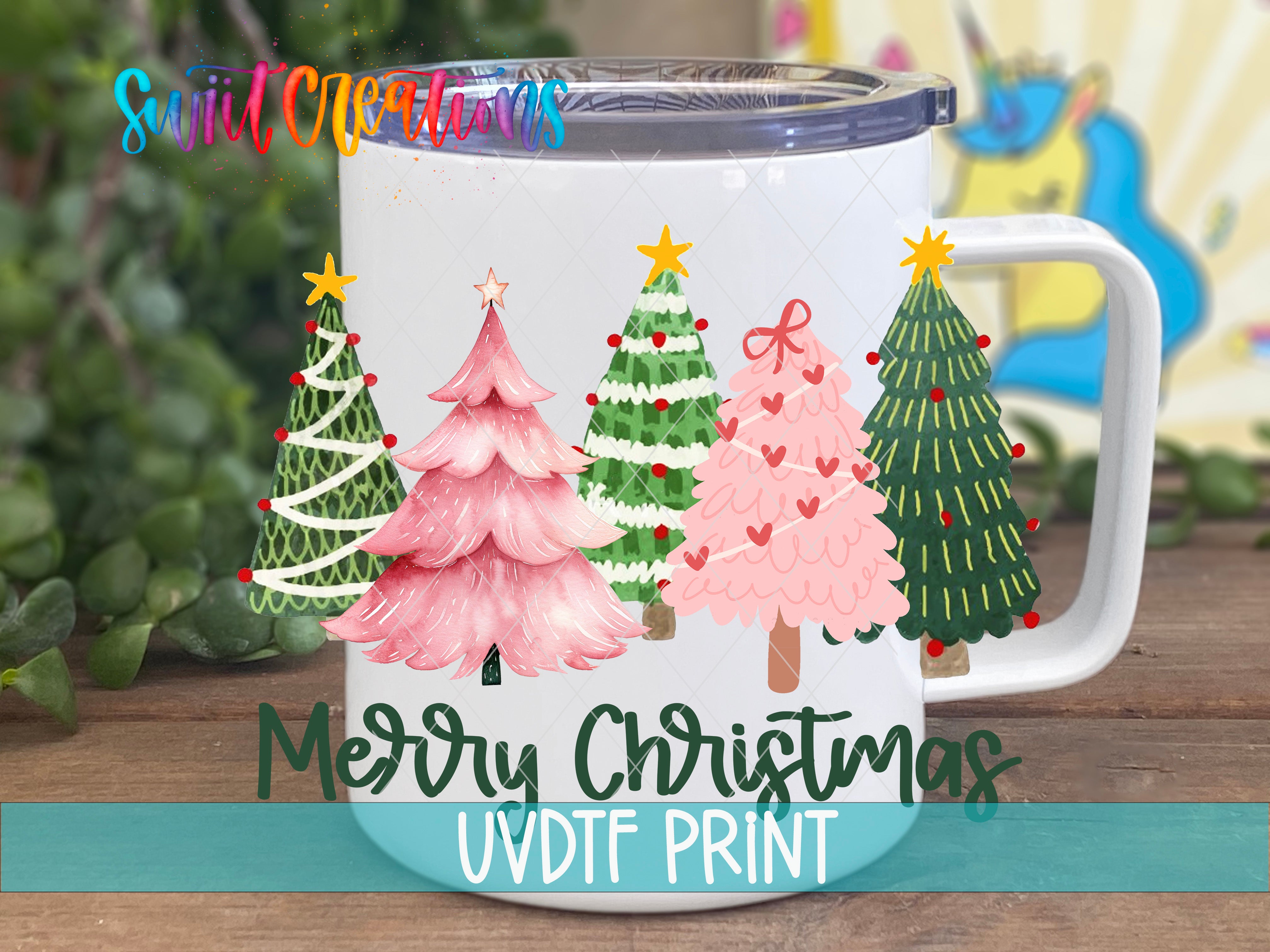A white mug with a festive Christmas tree design printed on it, placed on a wooden surface.