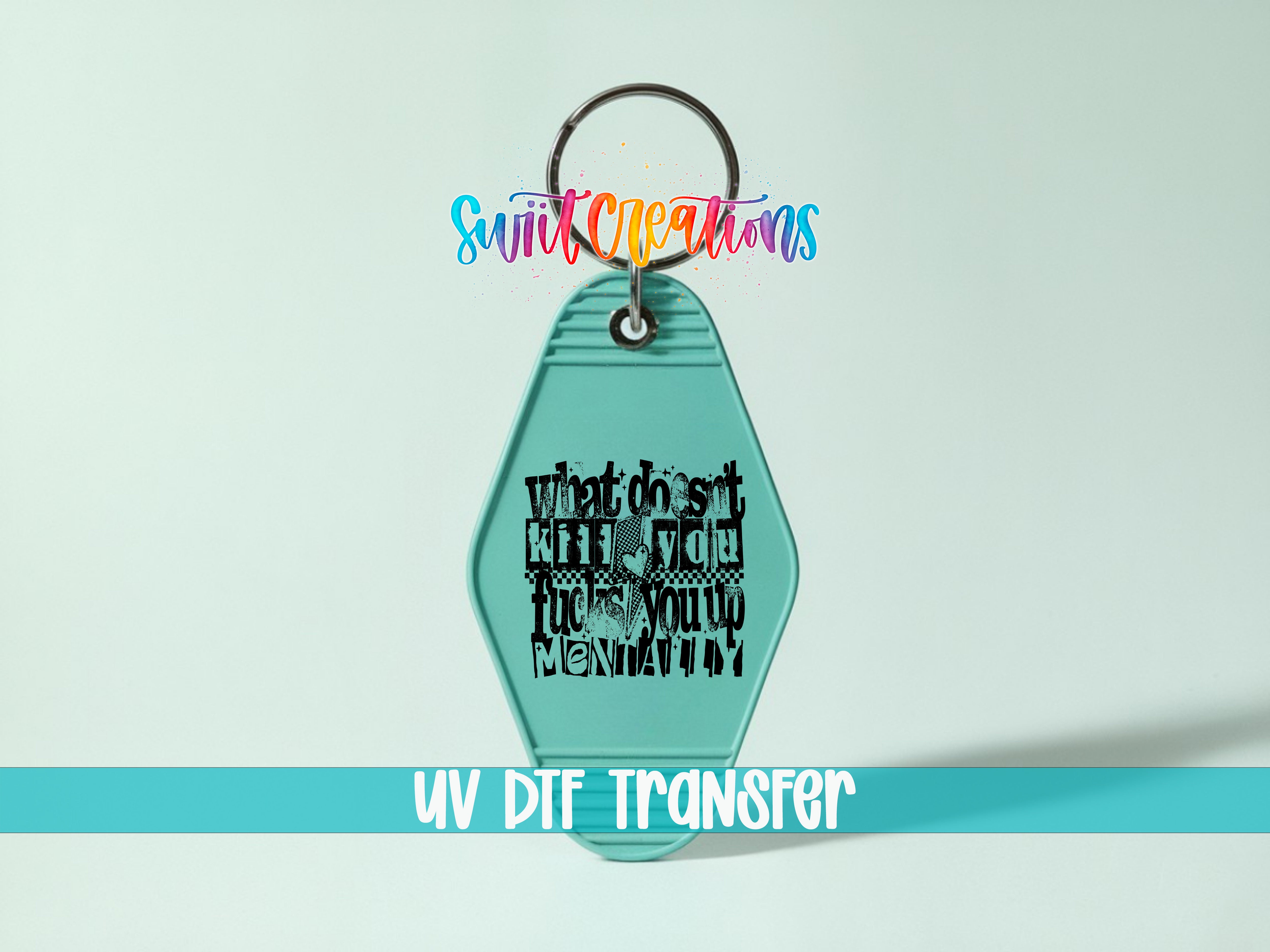 A turquoise keychain with a black text design on it, which appears to be a custom-made item.