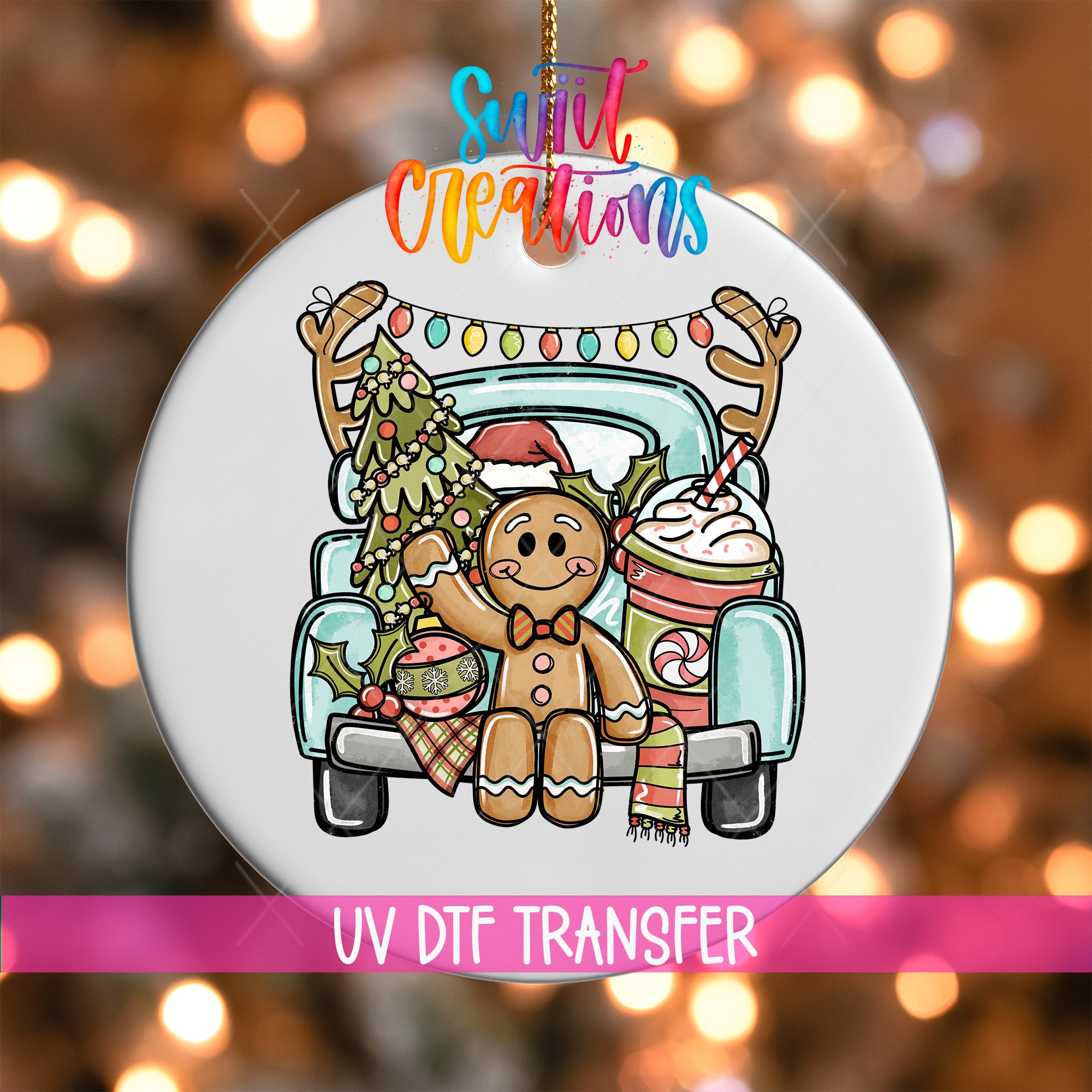A white ornament with a gingerbread man and Christmas decorations, including a decorated Christmas tree and a cup of hot chocolate, hanging from a truck.