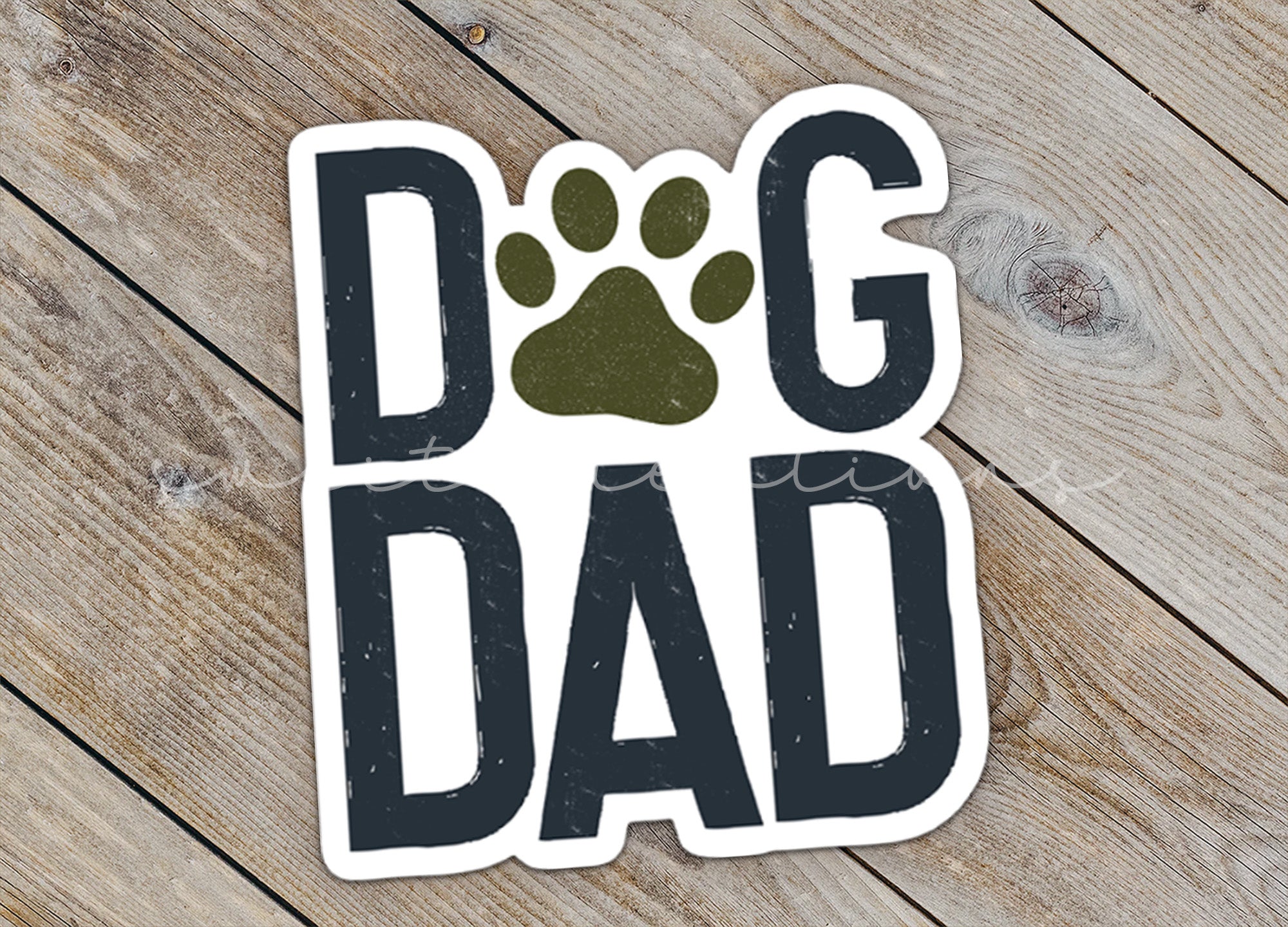 a sticker that says dog dad with a paw print