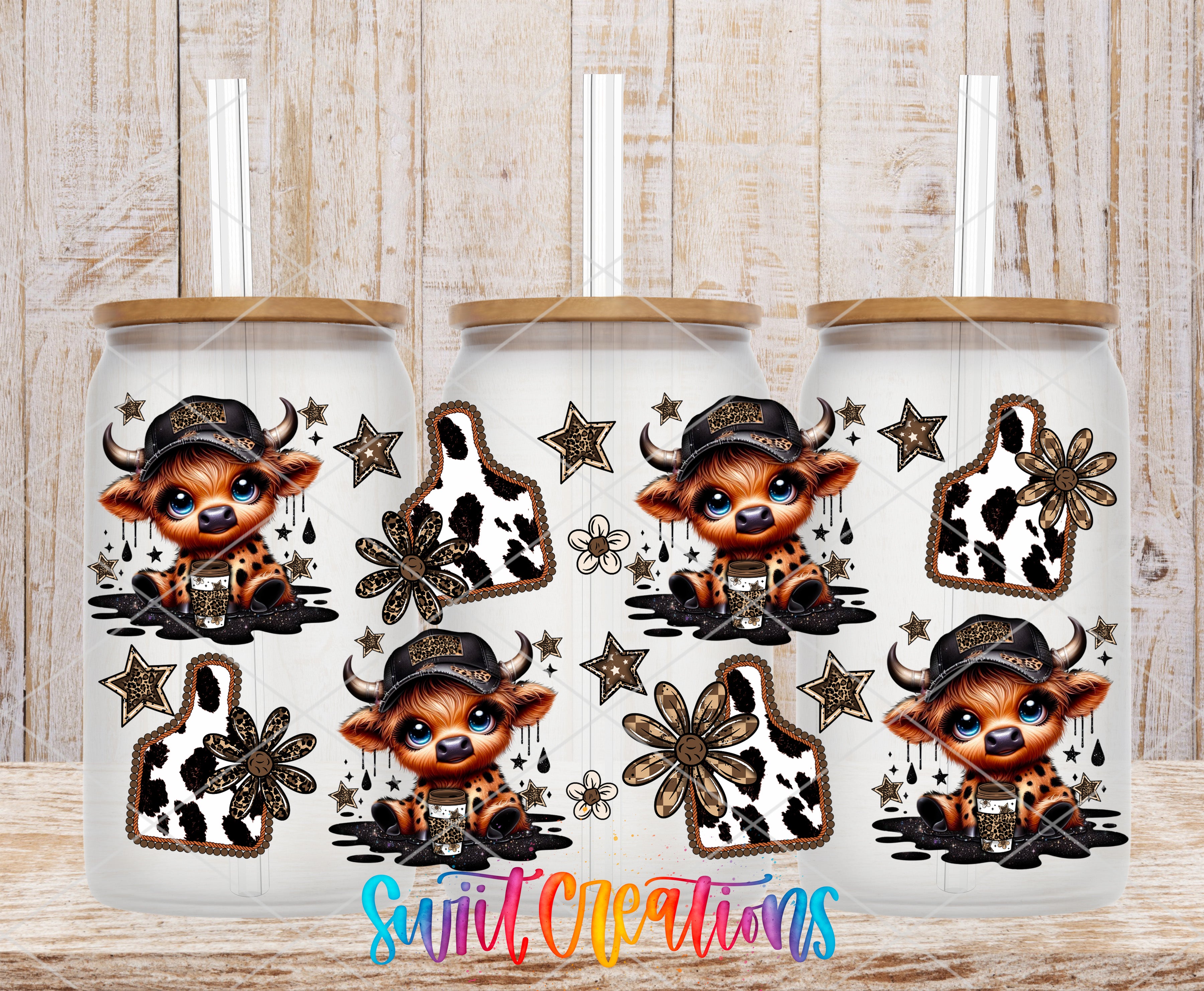 three white tumblers with black and white cow designs and star-shaped decorations.