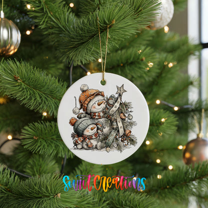 A white ceramic ornament with a snowman and star on a Christmas tree, surrounded by other ornaments and lights.