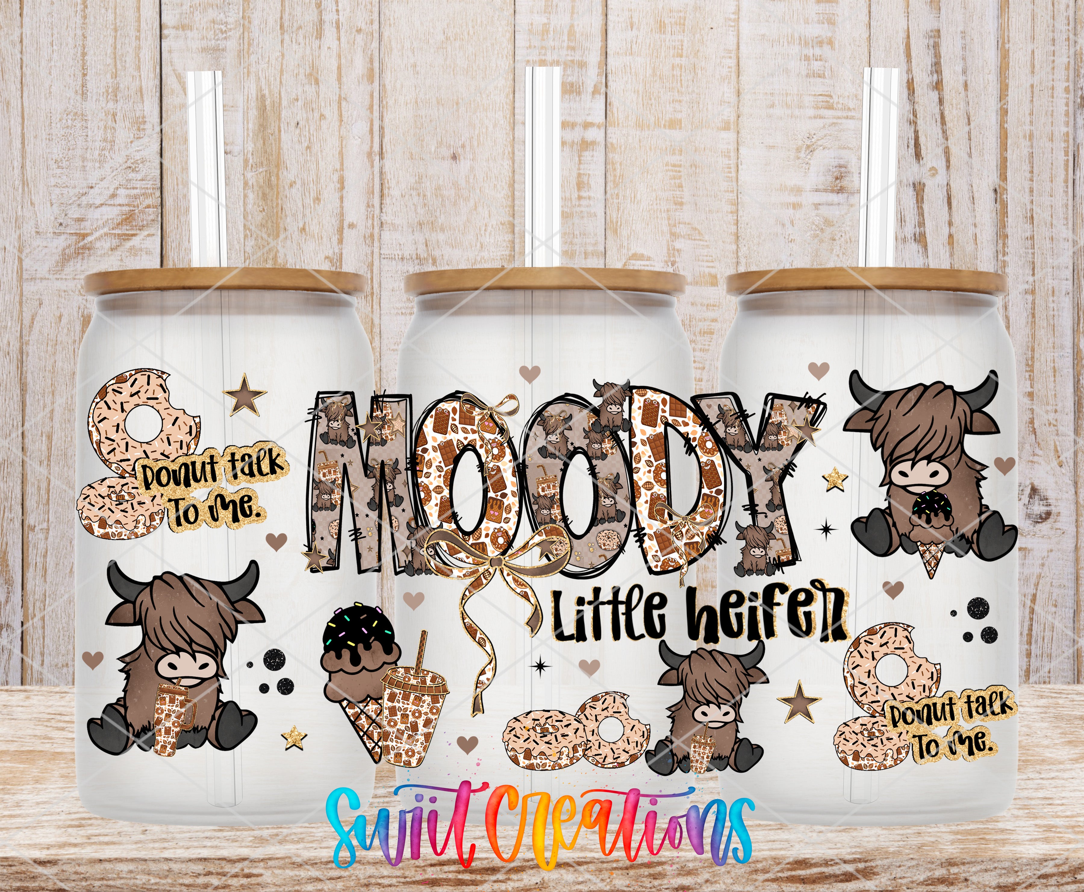 three glass tumblers with a playful and whimsical design. The tumblers are decorated with cartoon cow illustrations, ice cream cones, and the word "MODY" prominently displayed. The tumblers also have straws and the text "Don't talk to me" written on them.