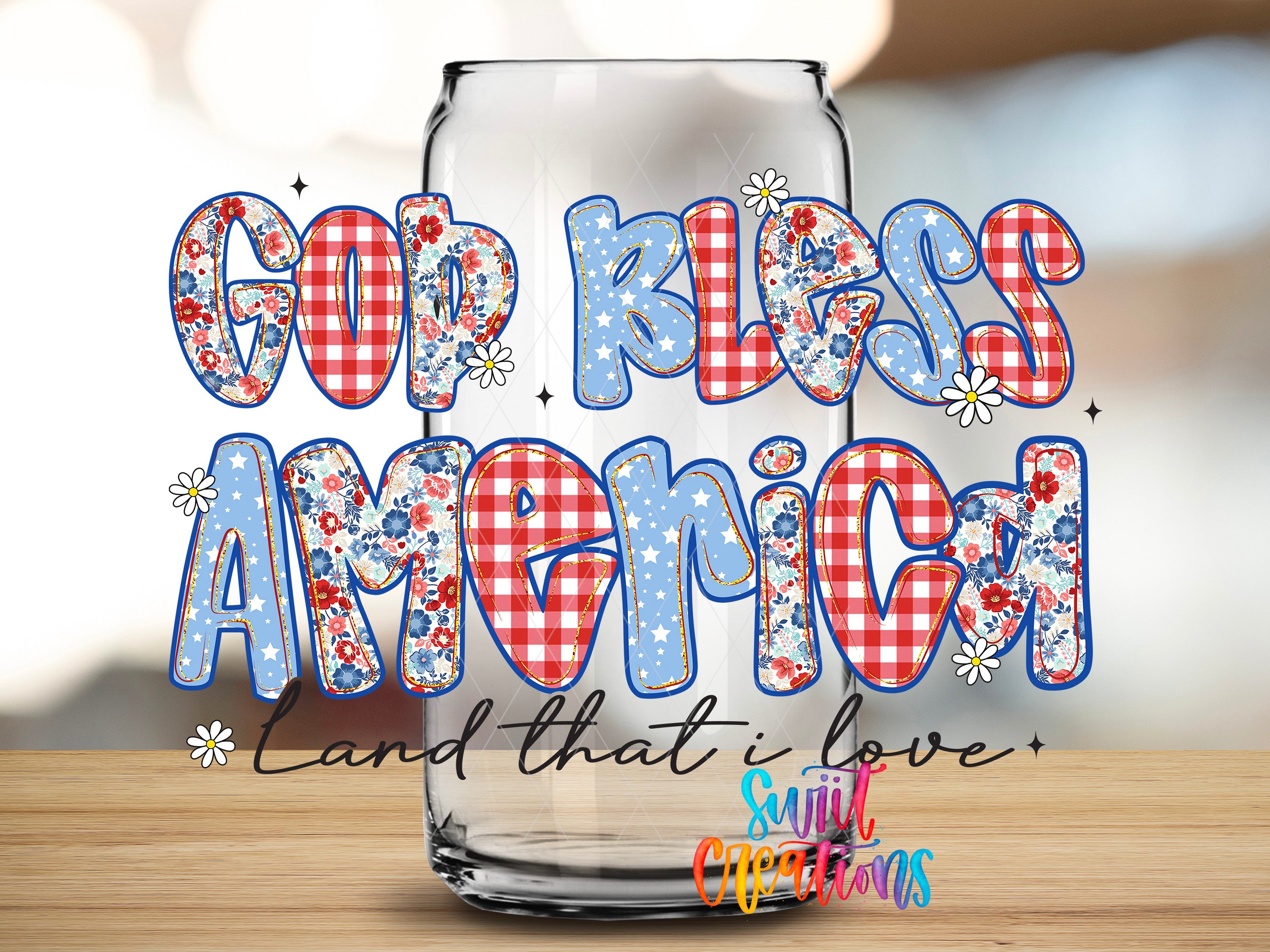 a glass can with the text "Gup Bless America" written on it, along with a floral pattern and stars.