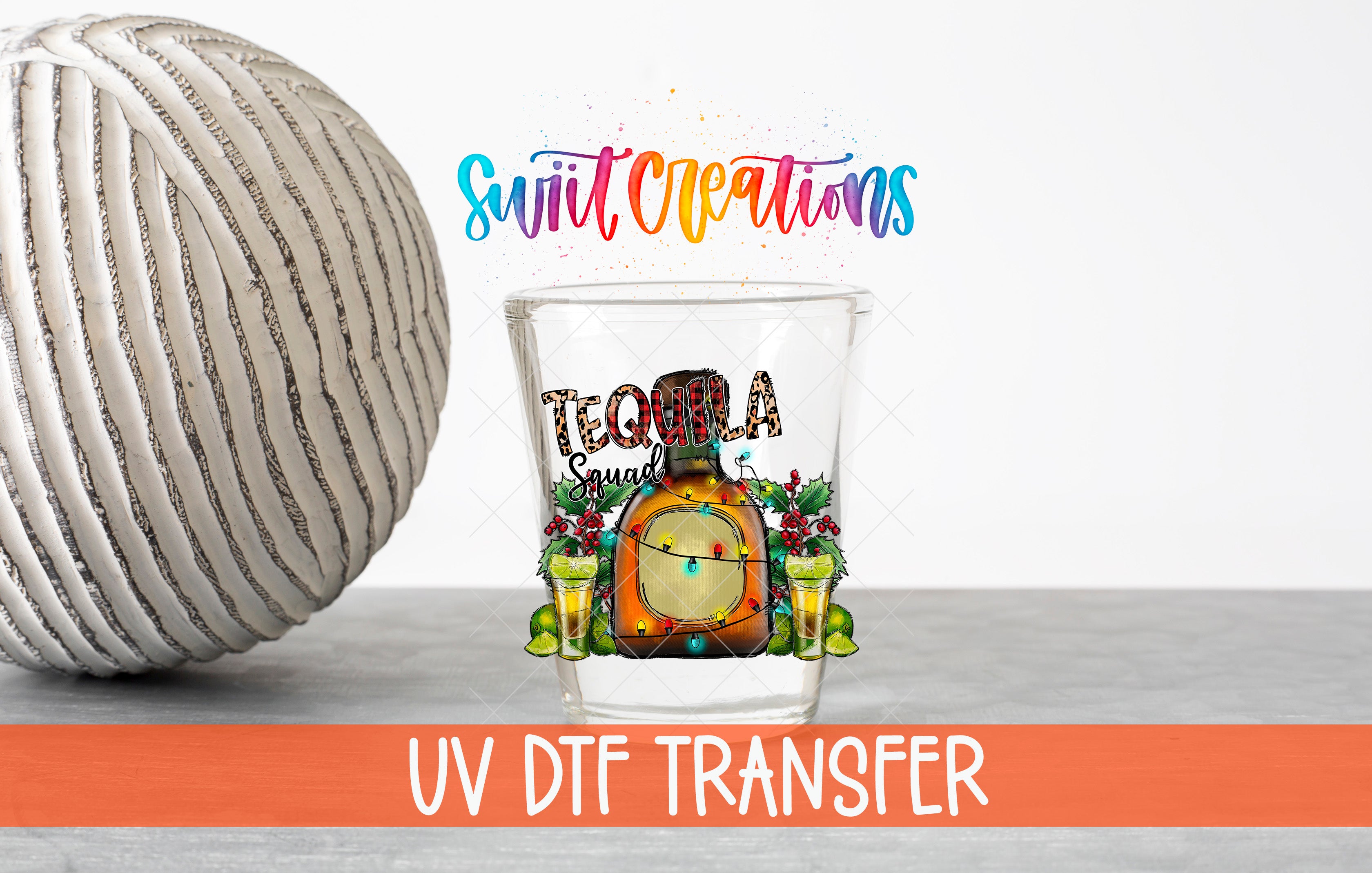 a glass with a tequila-themed design, including a bottle of tequila, a clock, and a lime, along with the text "UV DFT Transfer".