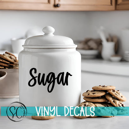 a cookie jar sitting on top of a counter next to cookies