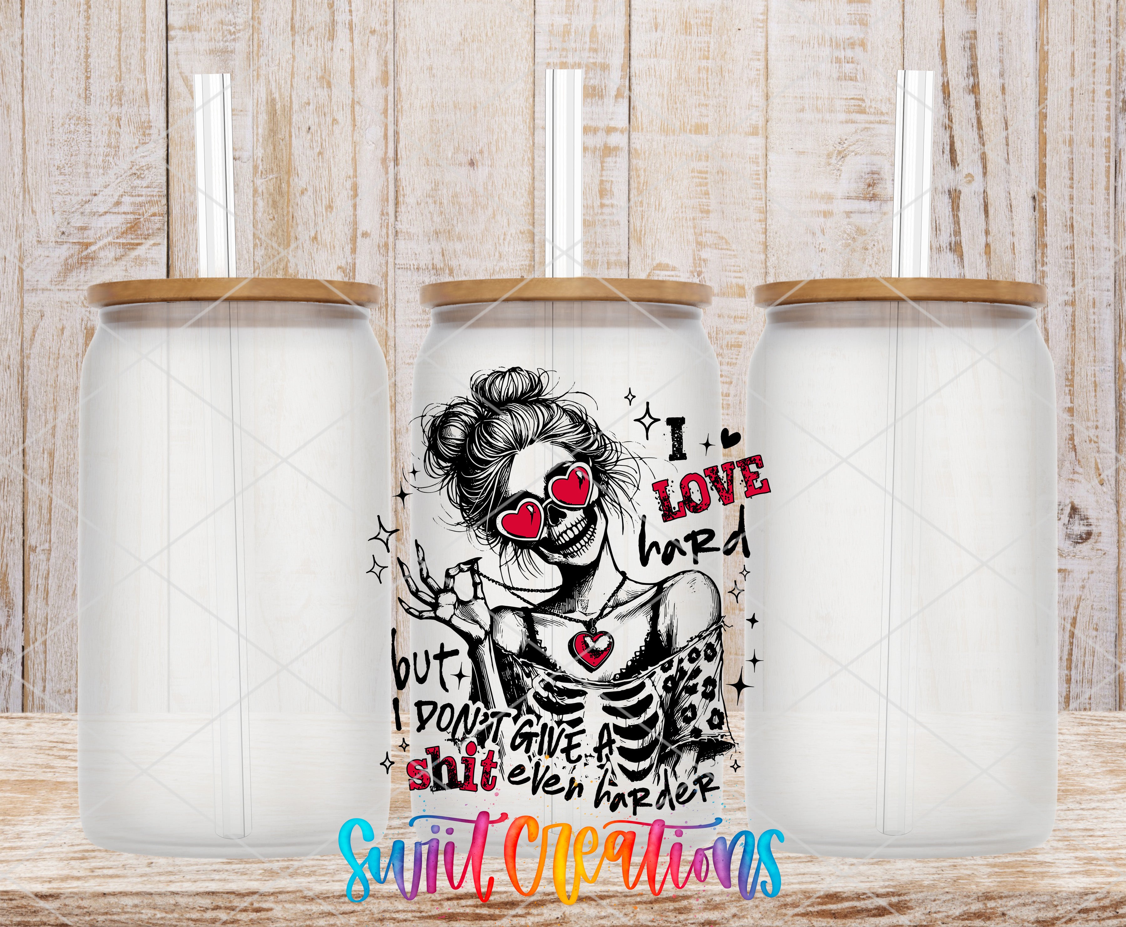 A white glass can with a black and red graphic design featuring a skeleton wearing sunglasses and the text "I LOVE hard but don't give a SHIT even harder".