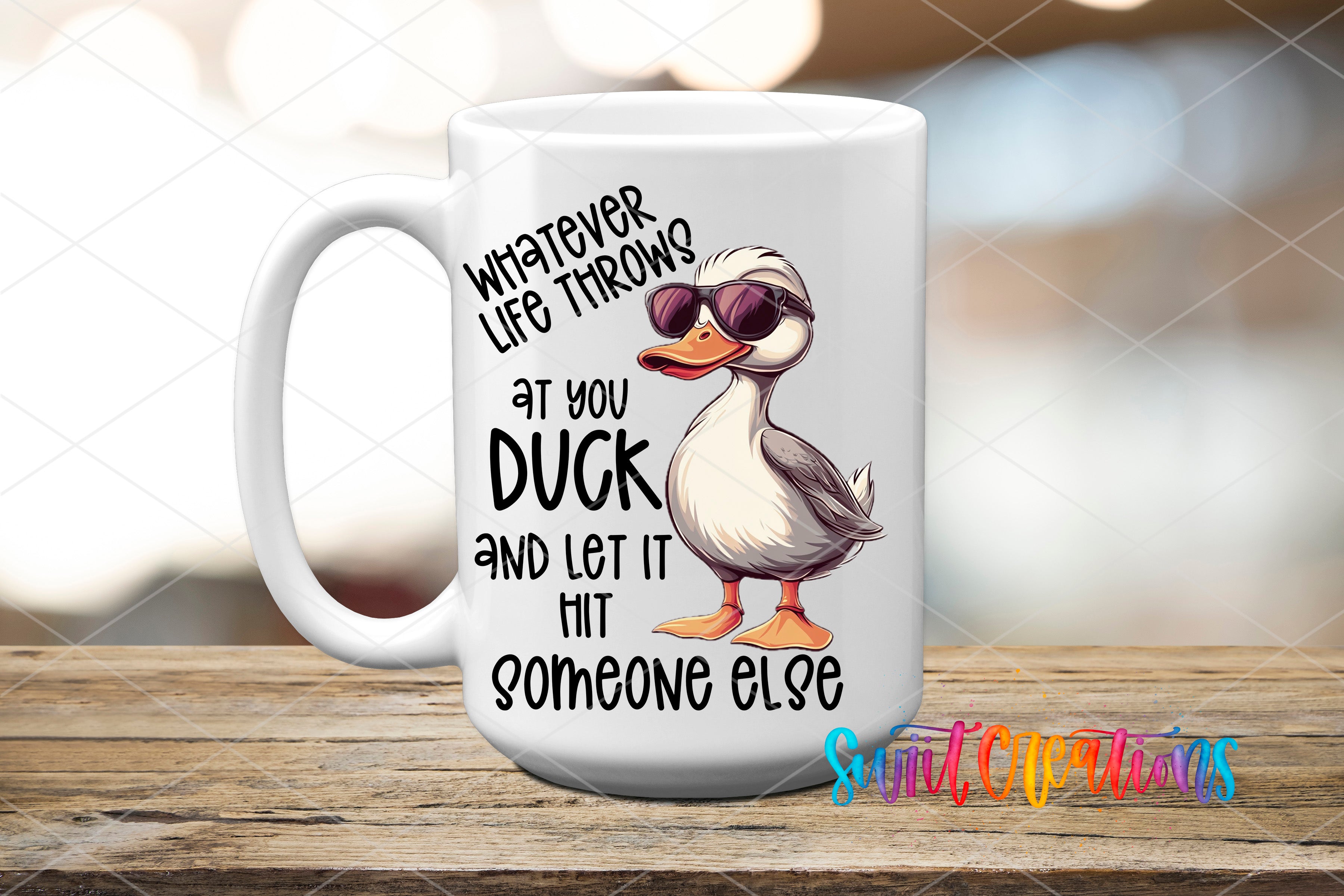 A white ceramic mug with a cartoon duck wearing sunglasses and text that reads "Whatever life throws at you, duck and let it hit someone else".