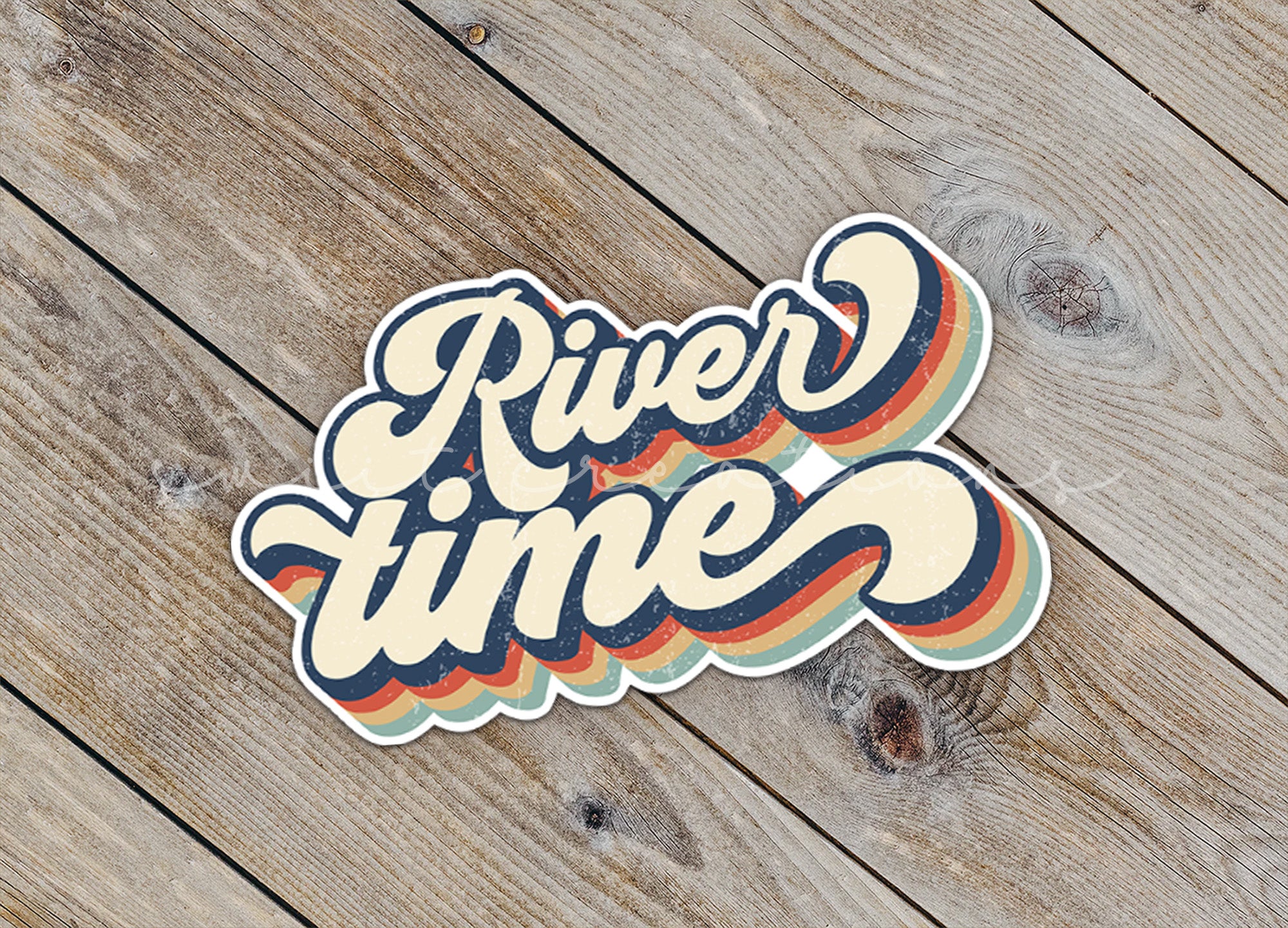 a sticker that says river time on a wooden surface