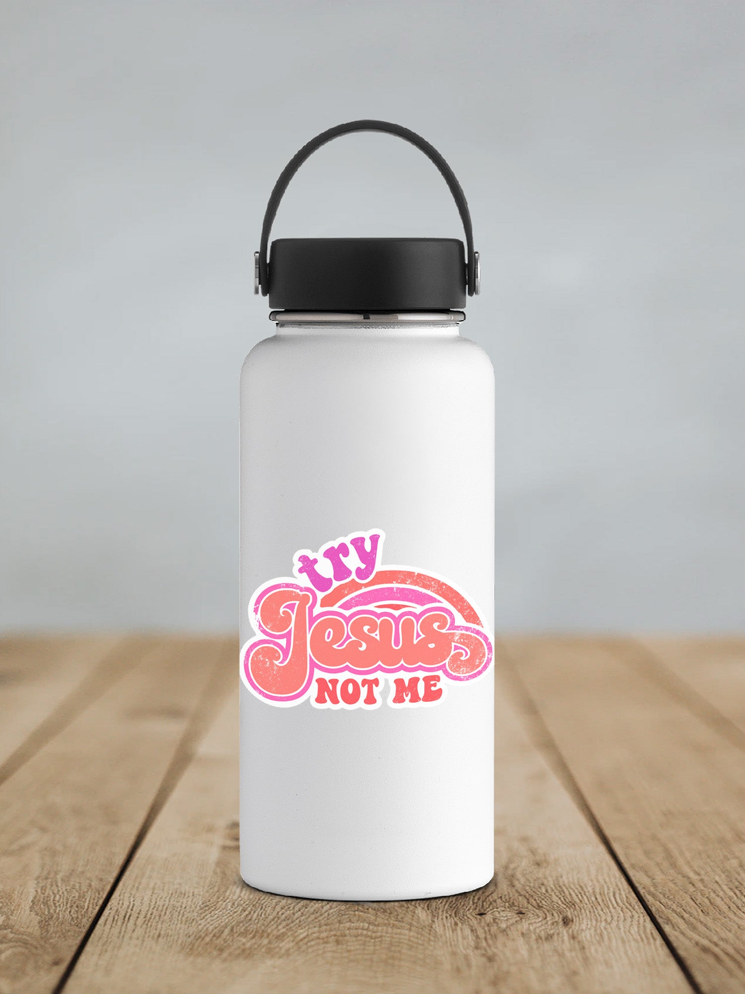 a white water bottle with a black lid on a wooden table