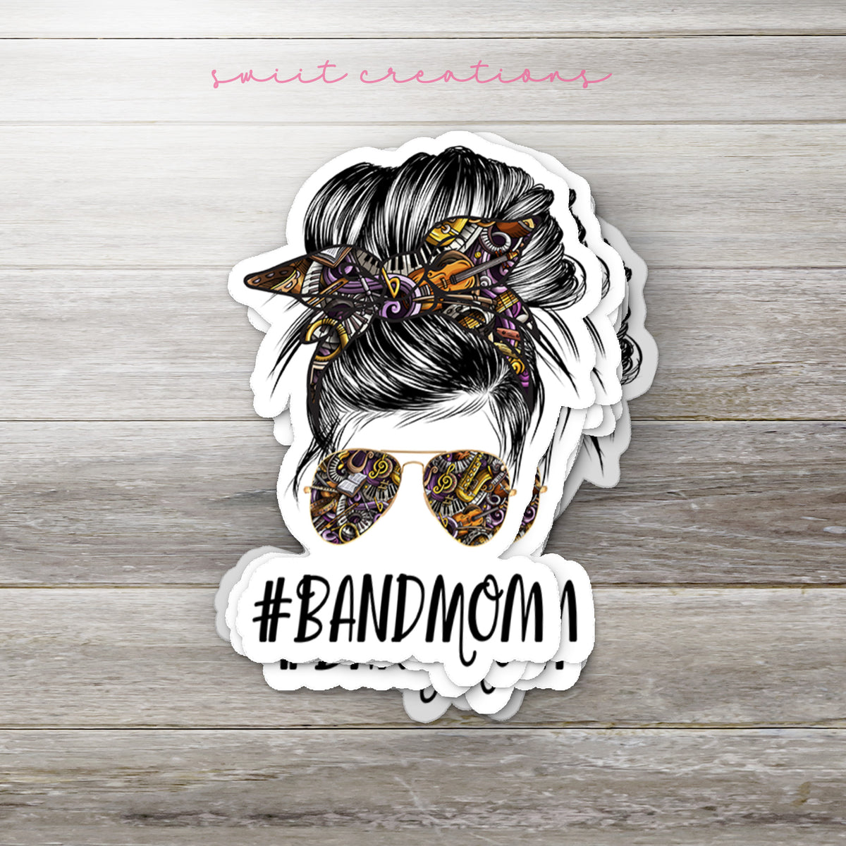 a sticker with a woman's hair and sunglasses on it