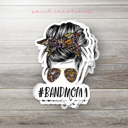 a sticker with a woman's hair and sunglasses on it