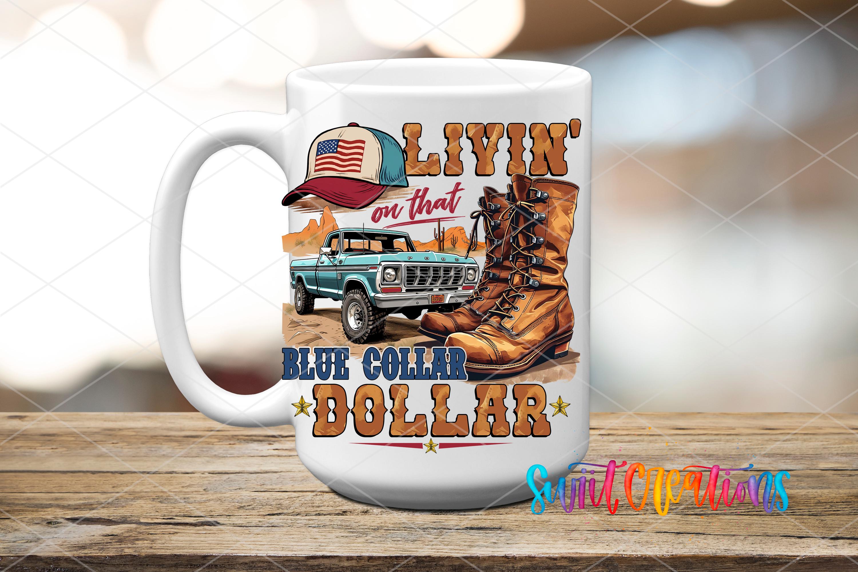 A white ceramic mug with a graphic design featuring a blue pickup truck, a cowboy hat, and a pair of boots, along with the text "LIVIN' on that BLUE COLLAR DOLLAR".