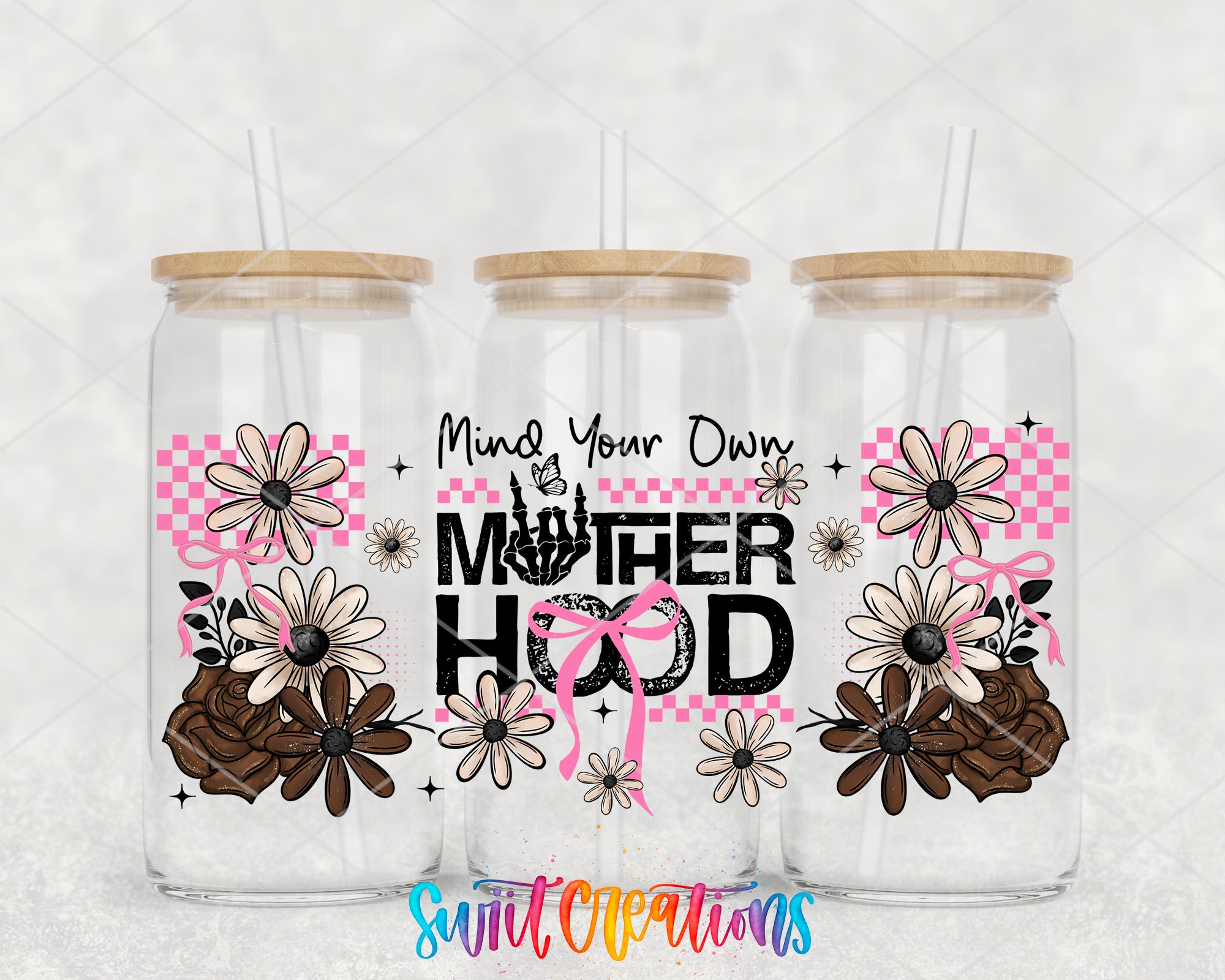 three glass tumblers with floral designs and text, including the phrase "Motherhood" and the words "Mind Your Own".