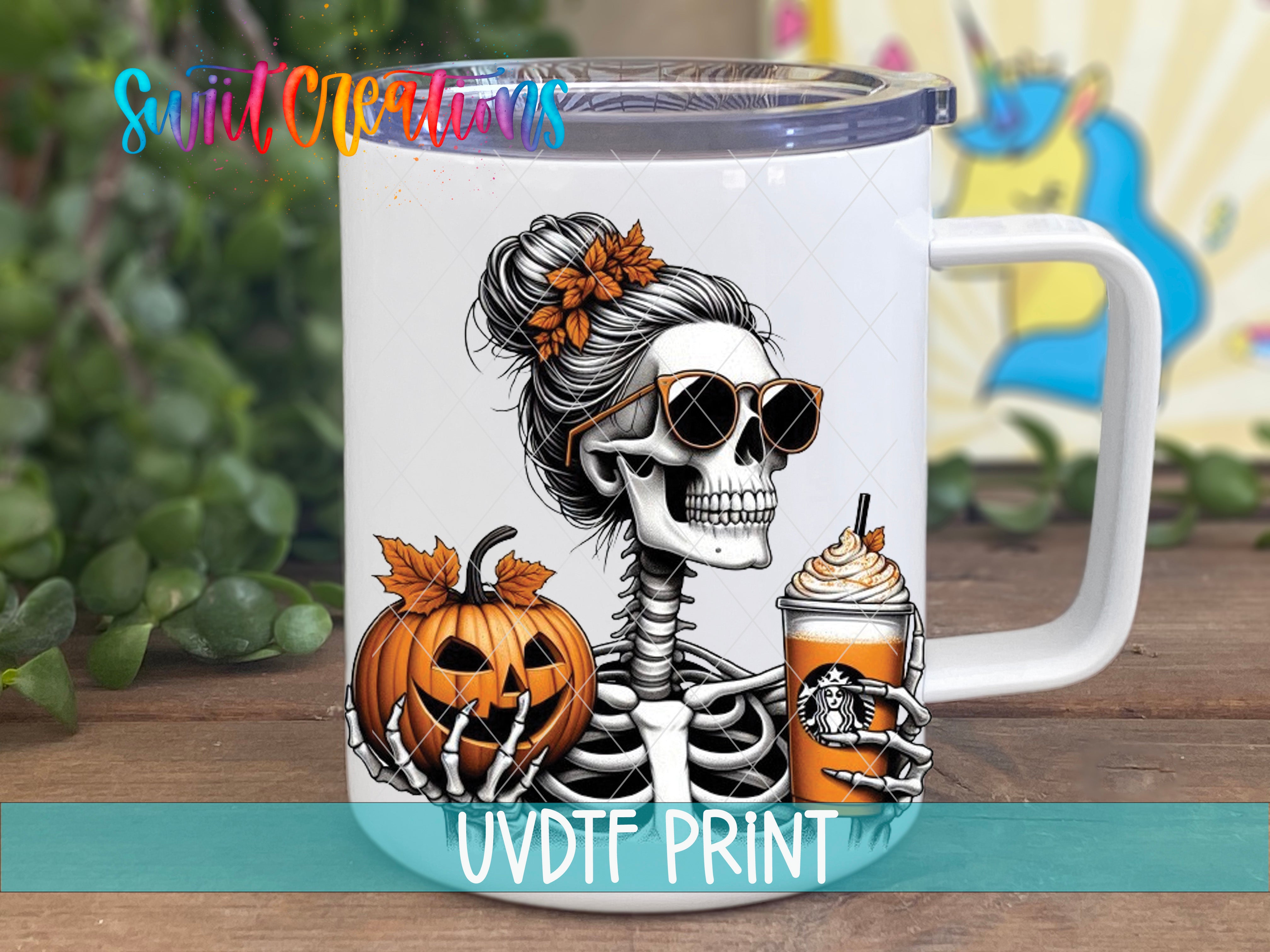 A white mug with a Halloween-themed design featuring a skeleton wearing sunglasses and holding a pumpkin and a Starbucks drink.