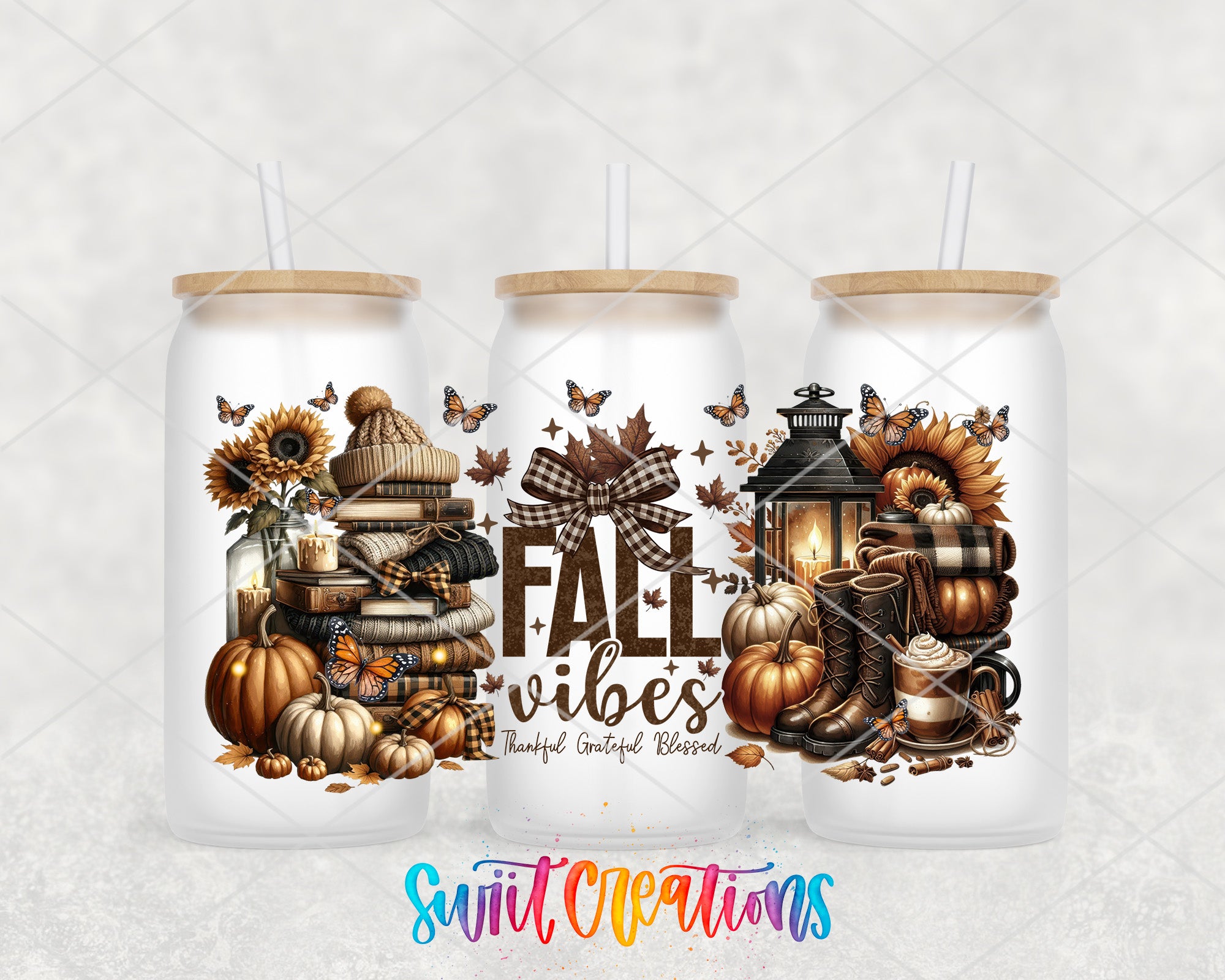 three glass tumblers with fall-themed designs, including pumpkins, lanterns, and other autumn-related items.