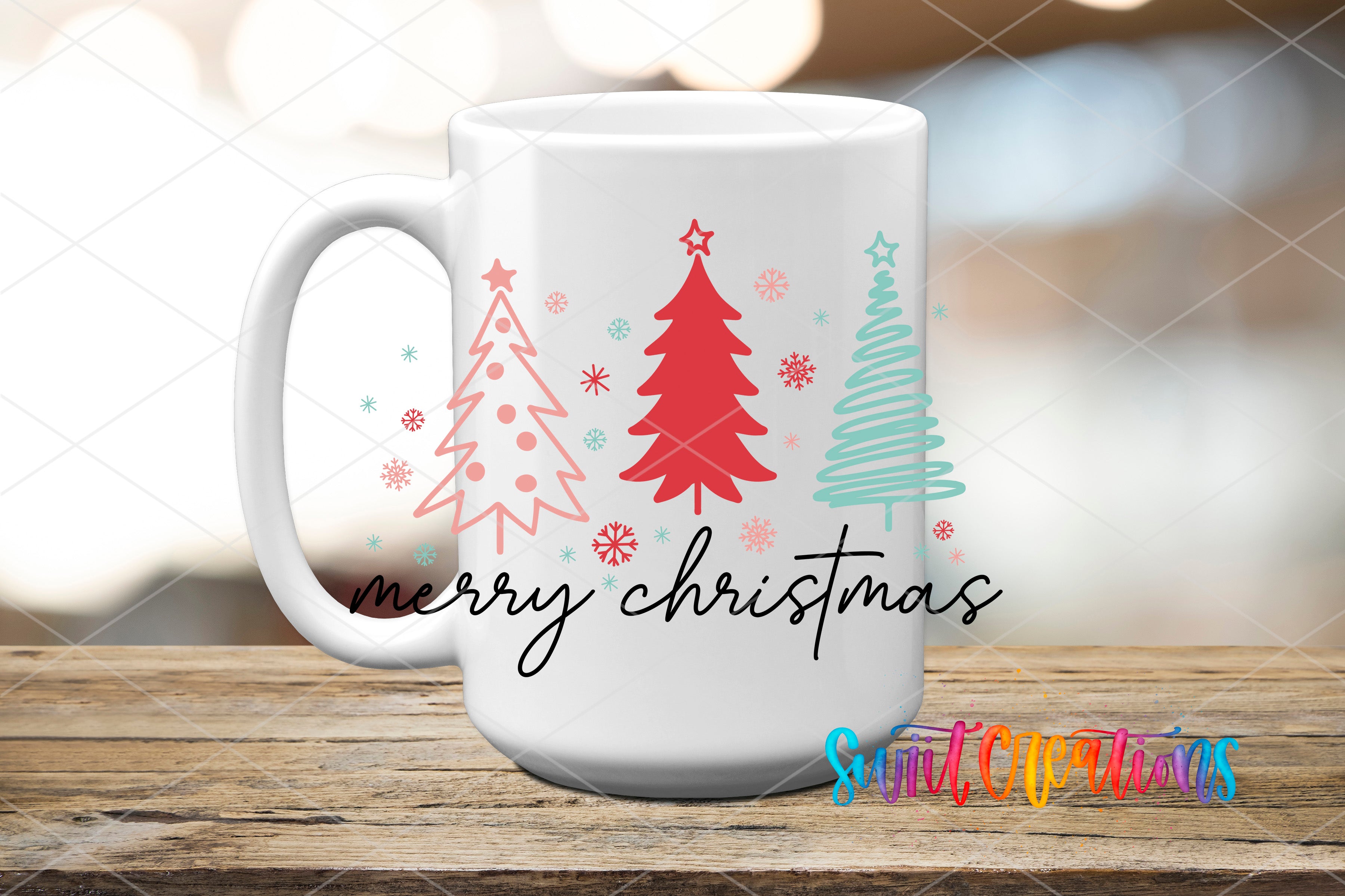 A white mug with a festive Christmas design featuring three stylized Christmas trees and snowflakes. The mug has the text "Merry Christmas" written on it.
