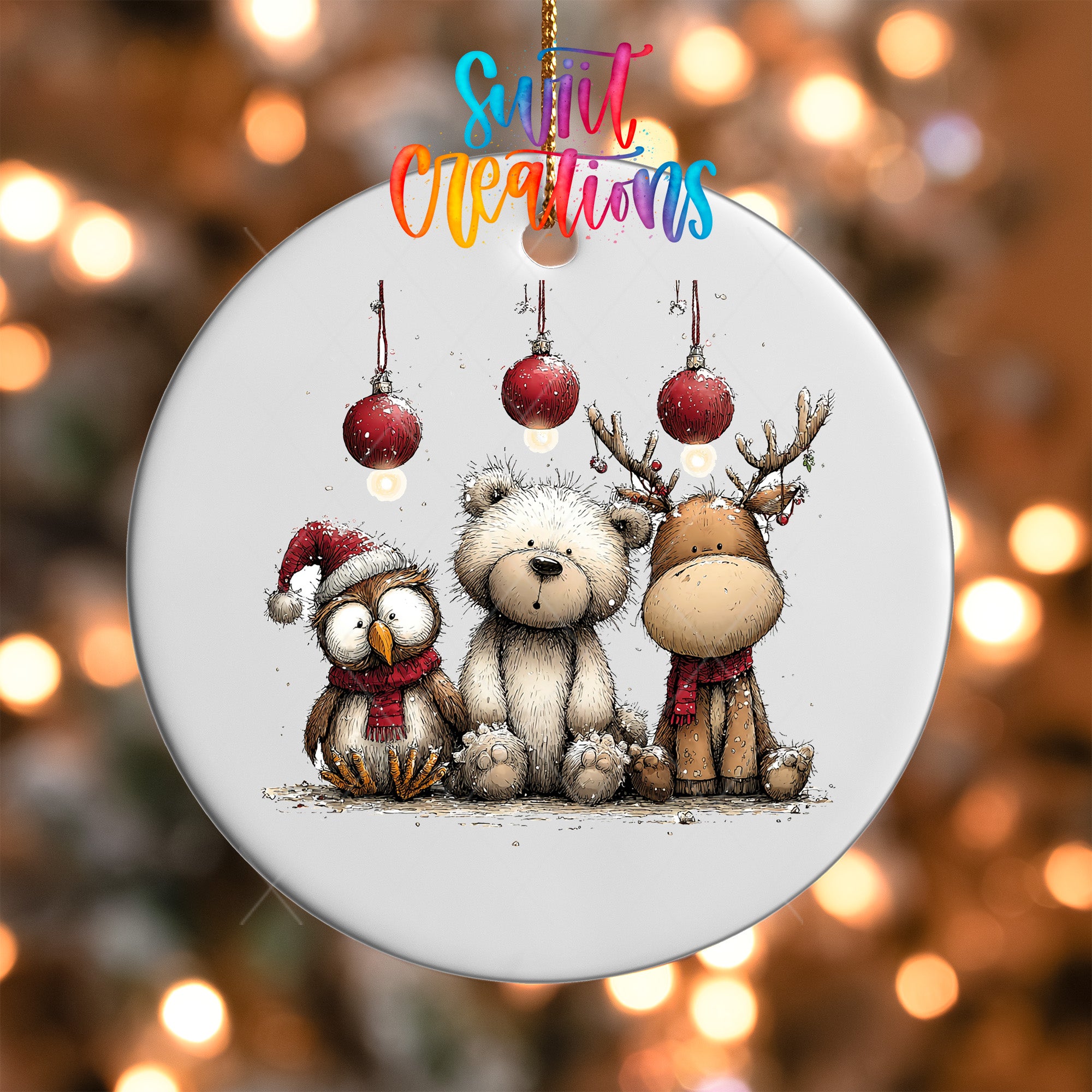 A white ornament with three Christmas ornaments hanging from it, depicting a bear, an owl, and a reindeer.