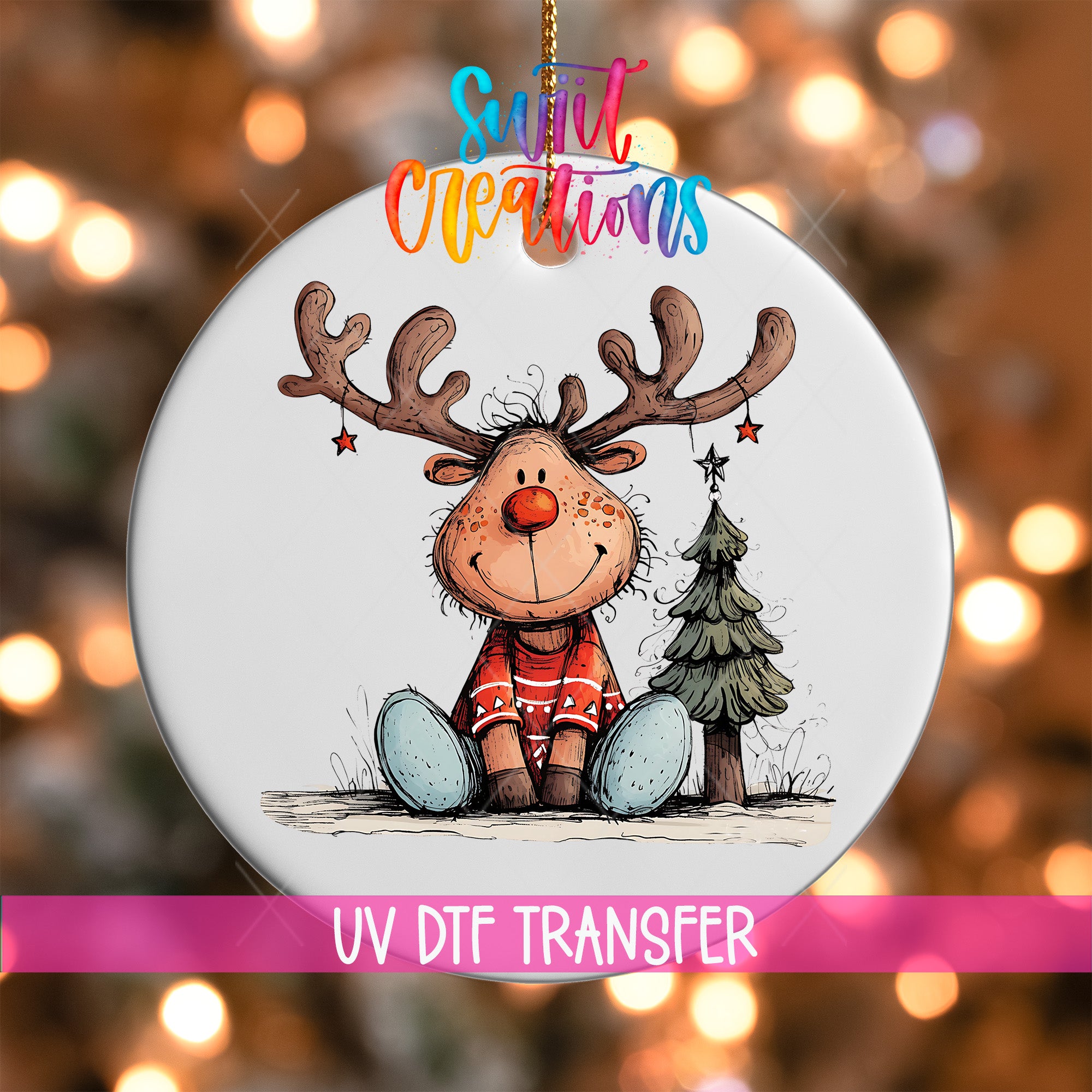 A white ornament with a cartoon reindeer and a Christmas tree, along with the text "UV Dtf Transfer" and "Sweet Creations" written above it.