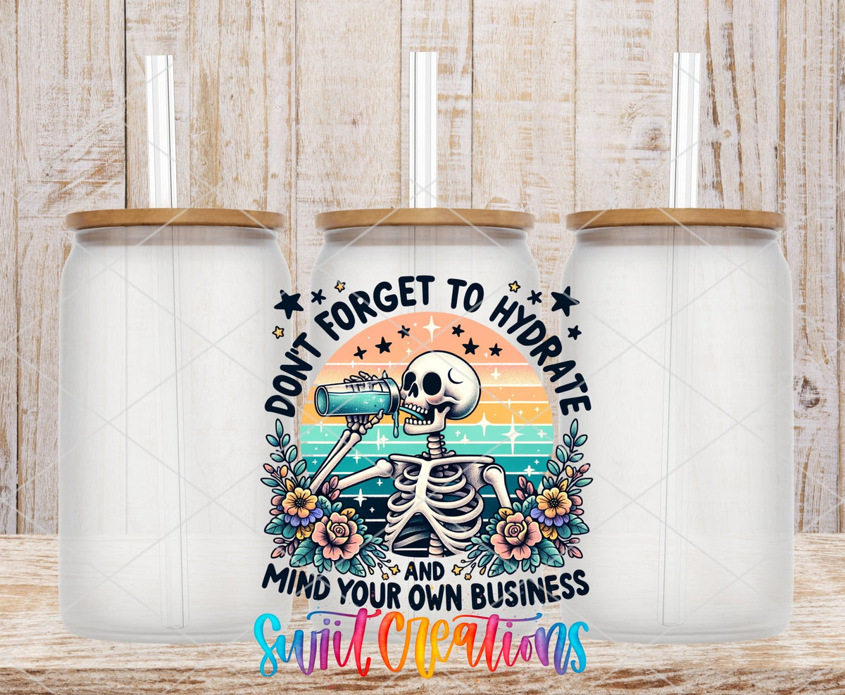 Don’t Forget to Hydrate UV DTF transfer applied to a clear glass can set from Swiit Creations