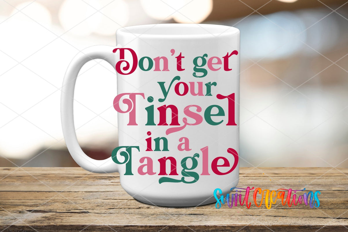 Swiit Creations UV DTF Don’t Get Your Tinsel In A Tangle transfer applied to a white ceramic mug